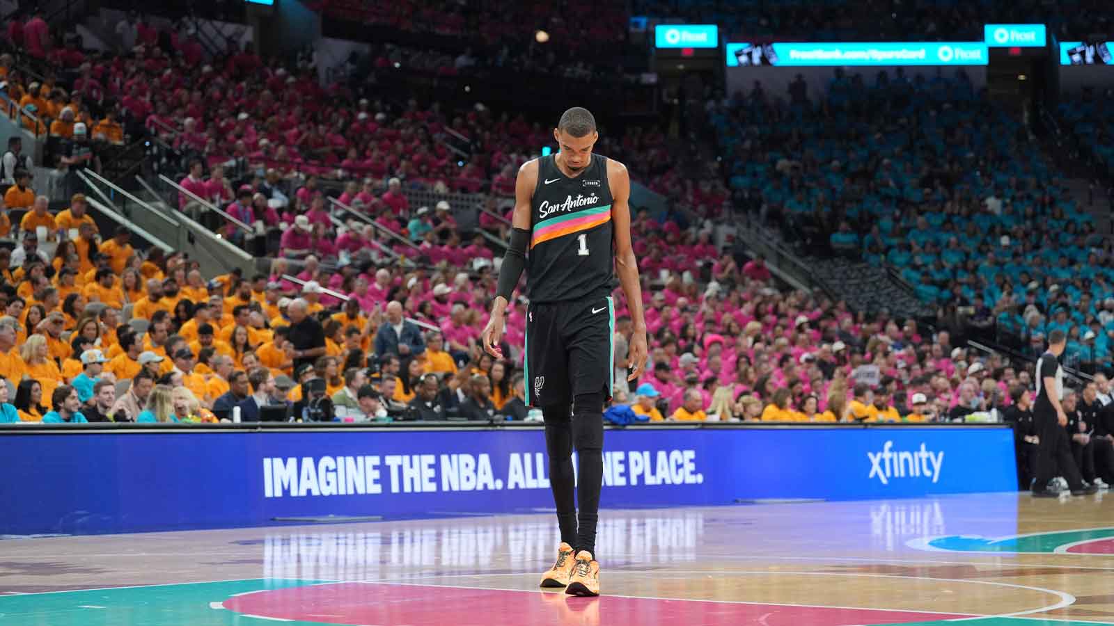 Spurs forward Victor Wembanyama (1) walks up the court