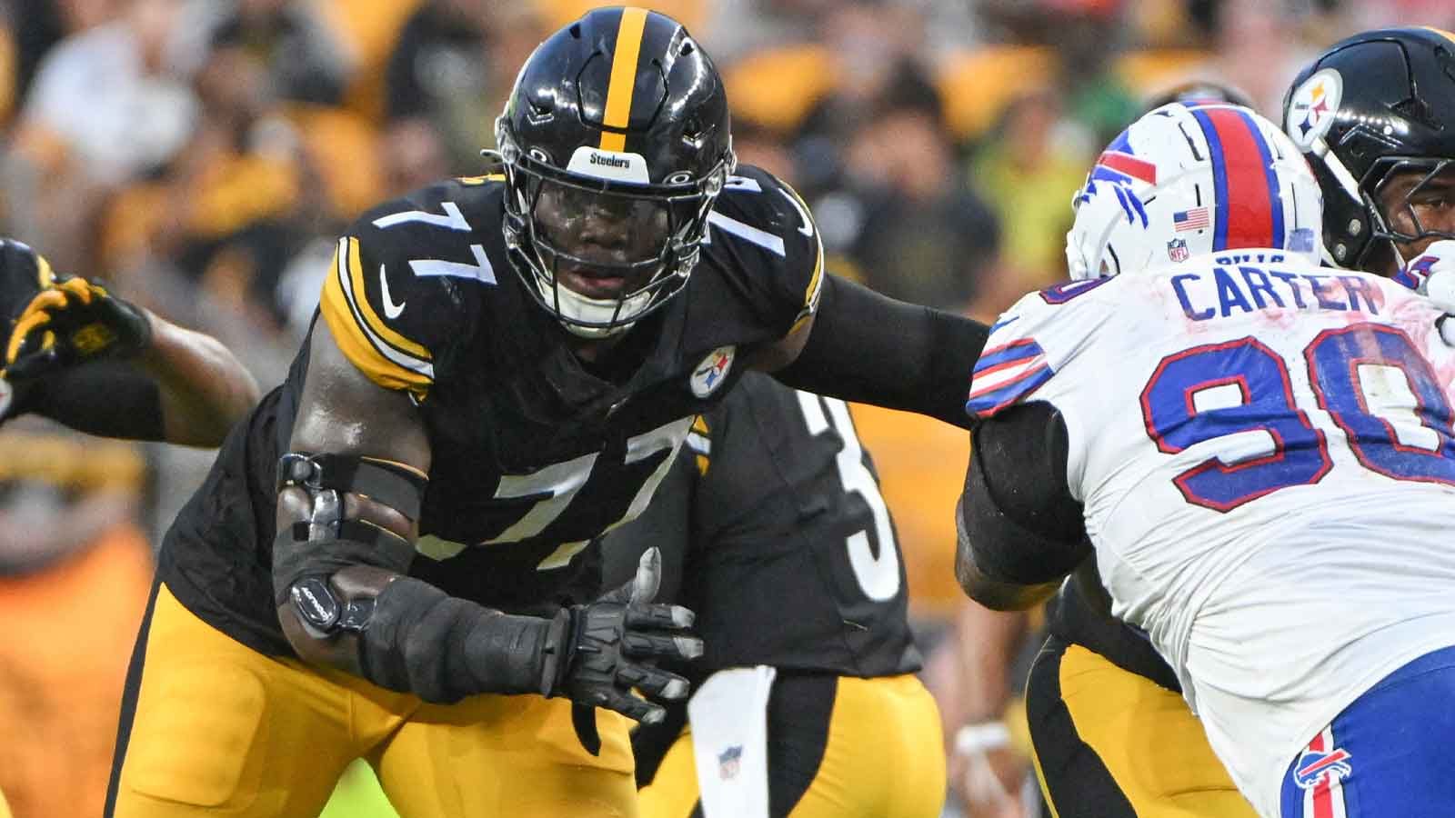 Pittsburgh Steelers offensive tackle Broderick Jones (77) blocks Buffalo Bills defensive tackle DeWayne Carter (90) during the first quarter at Acrisure Stadium.