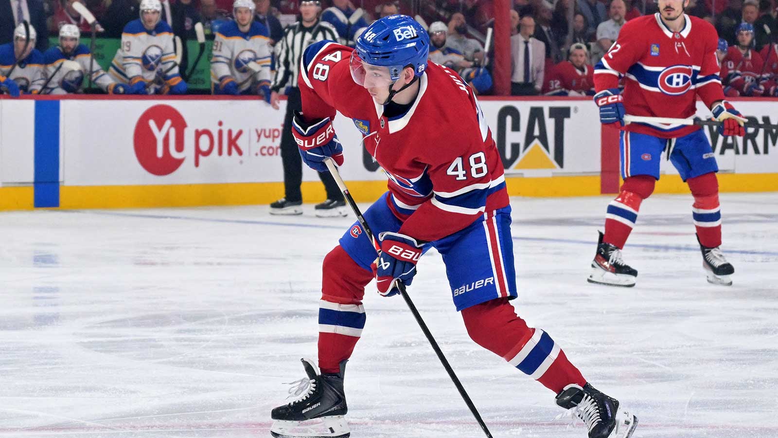 Montreal Canadiens defenseman Lane Hutson (48) plays the puck against the Buffalo Sabres during the third period in game three of the second round of the 2026 Stanley Cup Playoffs at the Bell Centre. 