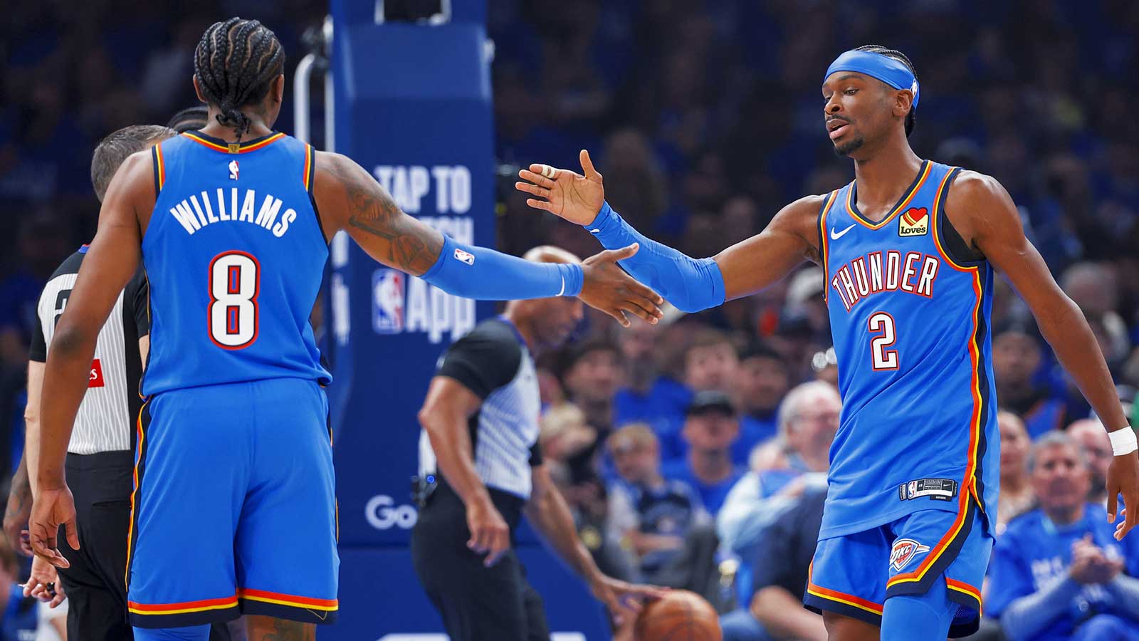 Thunder guard Shai Gilgeous-Alexander (2) and Oklahoma City Thunder guard Jalen Williams (8) celebrate after a play against the Phoenix Suns in the first quarter during game one of the first round of the 2026 NBA Playoffs at Paycom Center