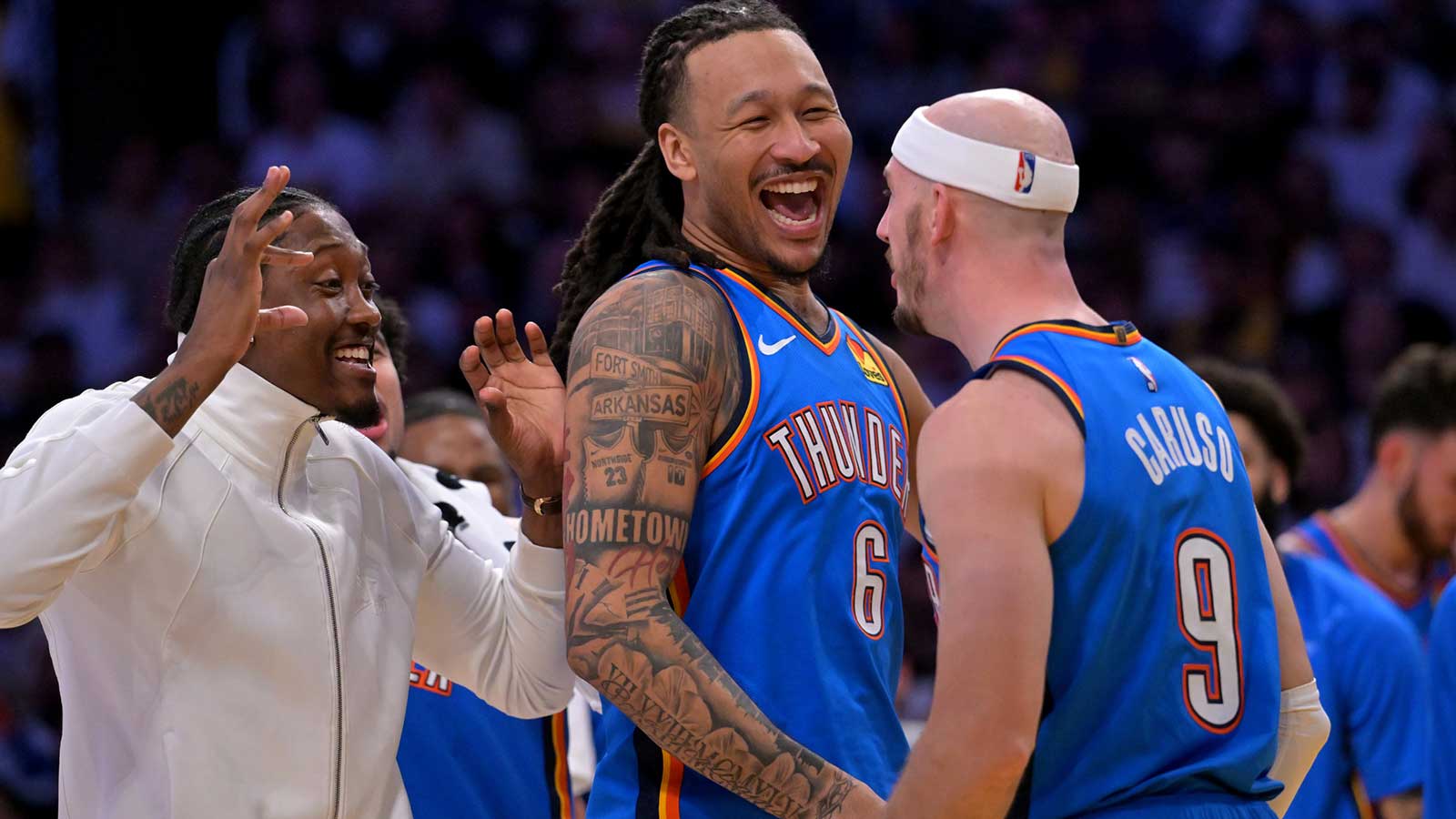 Thunder guard Jalen Williams (8), forward Jaylin Williams (6) celebrate with Oklahoma City Thunder guard Alex Caruso (9) after a basket in the second half of game three of the second round of the 2026 NBA Playoffs against the Los Angeles Lakers at Crypto.com Arena