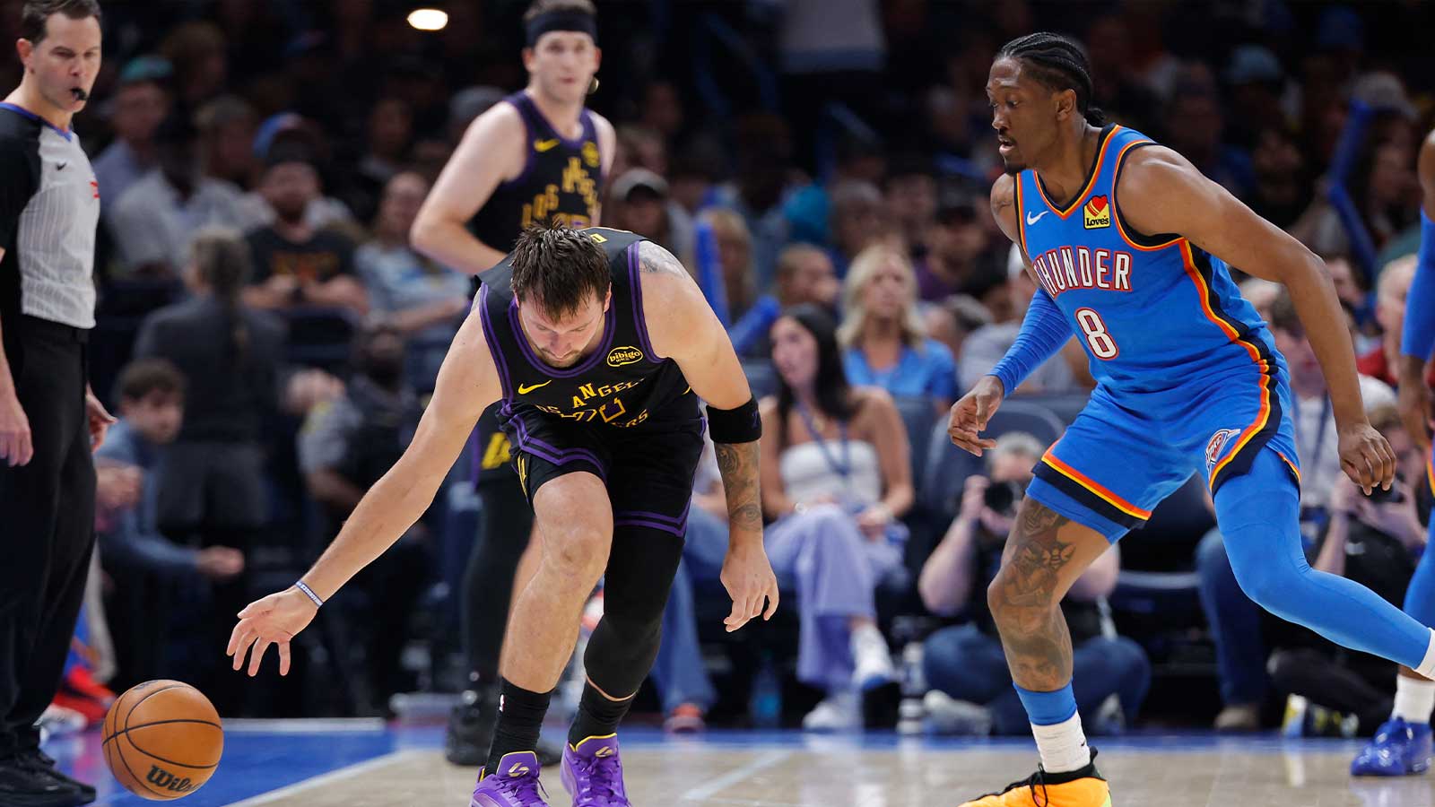 Lakers guard Luka Doncic (77) looses the ball during a drive against Oklahoma City Thunder guard Jalen Williams (8) during the second half at Paycom Center
