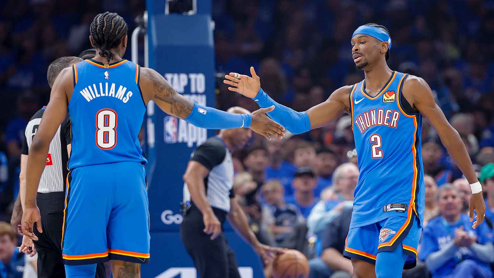 Thunder guard Shai Gilgeous-Alexander (2) and Oklahoma City Thunder guard Jalen Williams (8) celebrate after a play against the Phoenix Suns in the first quarter during game one of the first round of the 2026 NBA Playoffs at Paycom Center