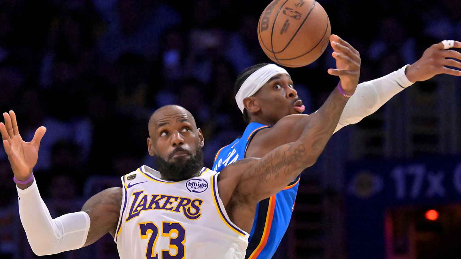Thunder guard Shai Gilgeous-Alexander (2) defends Los Angeles Lakers forward LeBron James (23) in the second half of game three of the second round of the 2026 NBA Playoffs at Crypto.com Arena