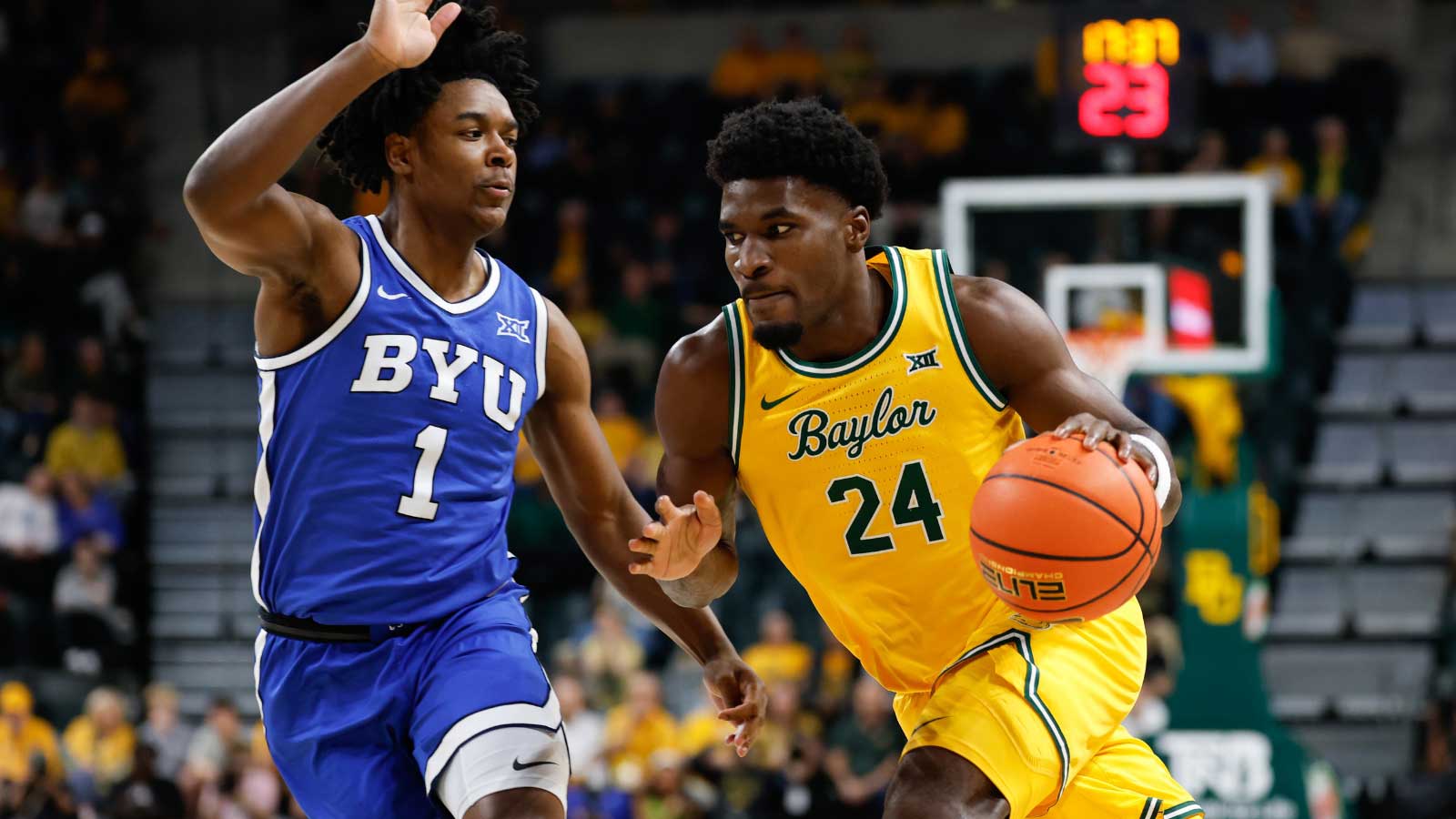 Baylor Bears guard Tounde Yessoufou (24) drives to the basket as BYU Cougars guard Robert Wright III (1) defends during the first half at Paul and Alejandra Foster Pavilion.