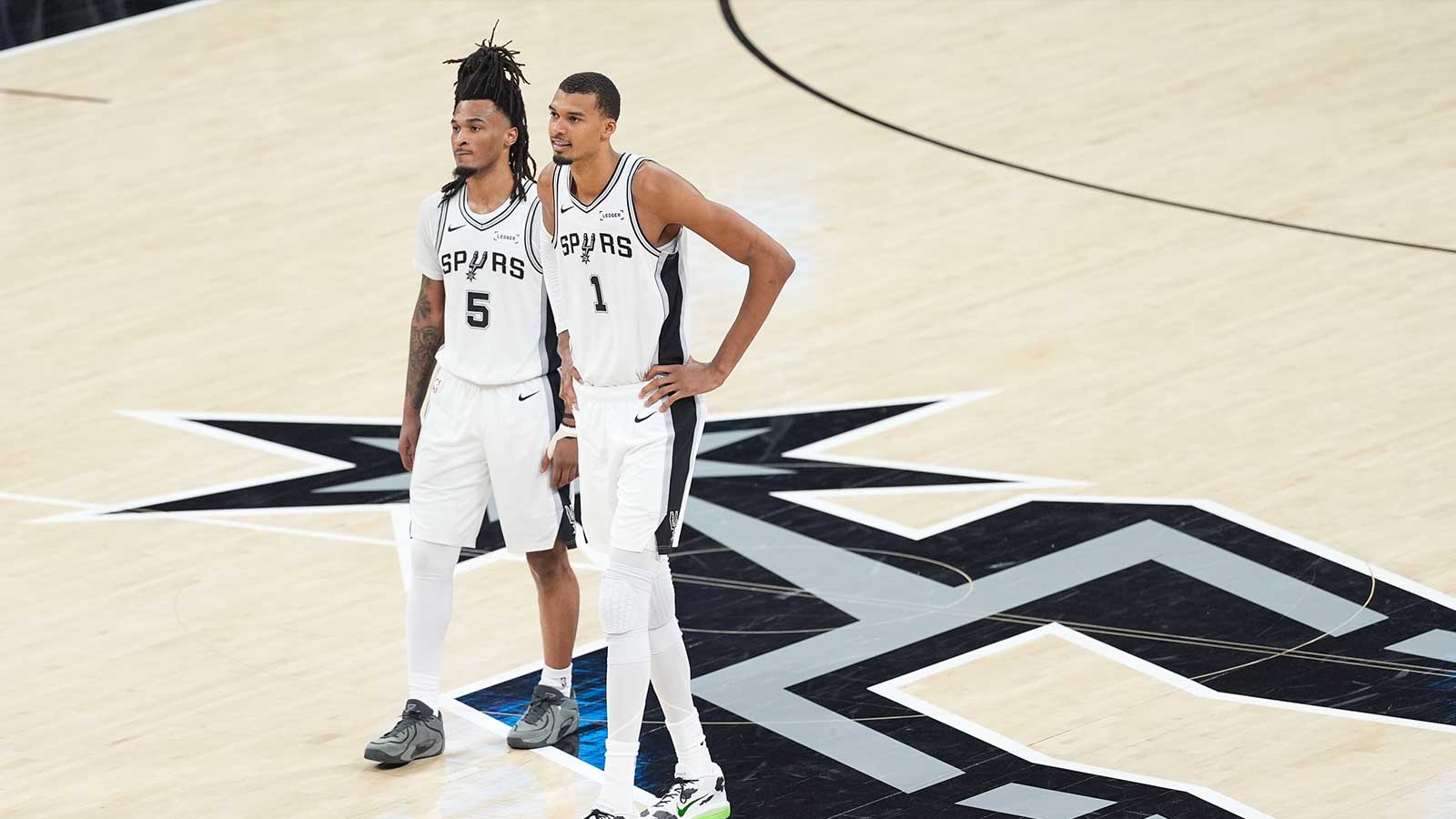 https://wp.clutchpoints.com/wp-content/uploads/2026/05/Victor-Wembanyama-and-Stephon-Castle-look-on-against-the-Oklahoma-City-Thunder.jpg