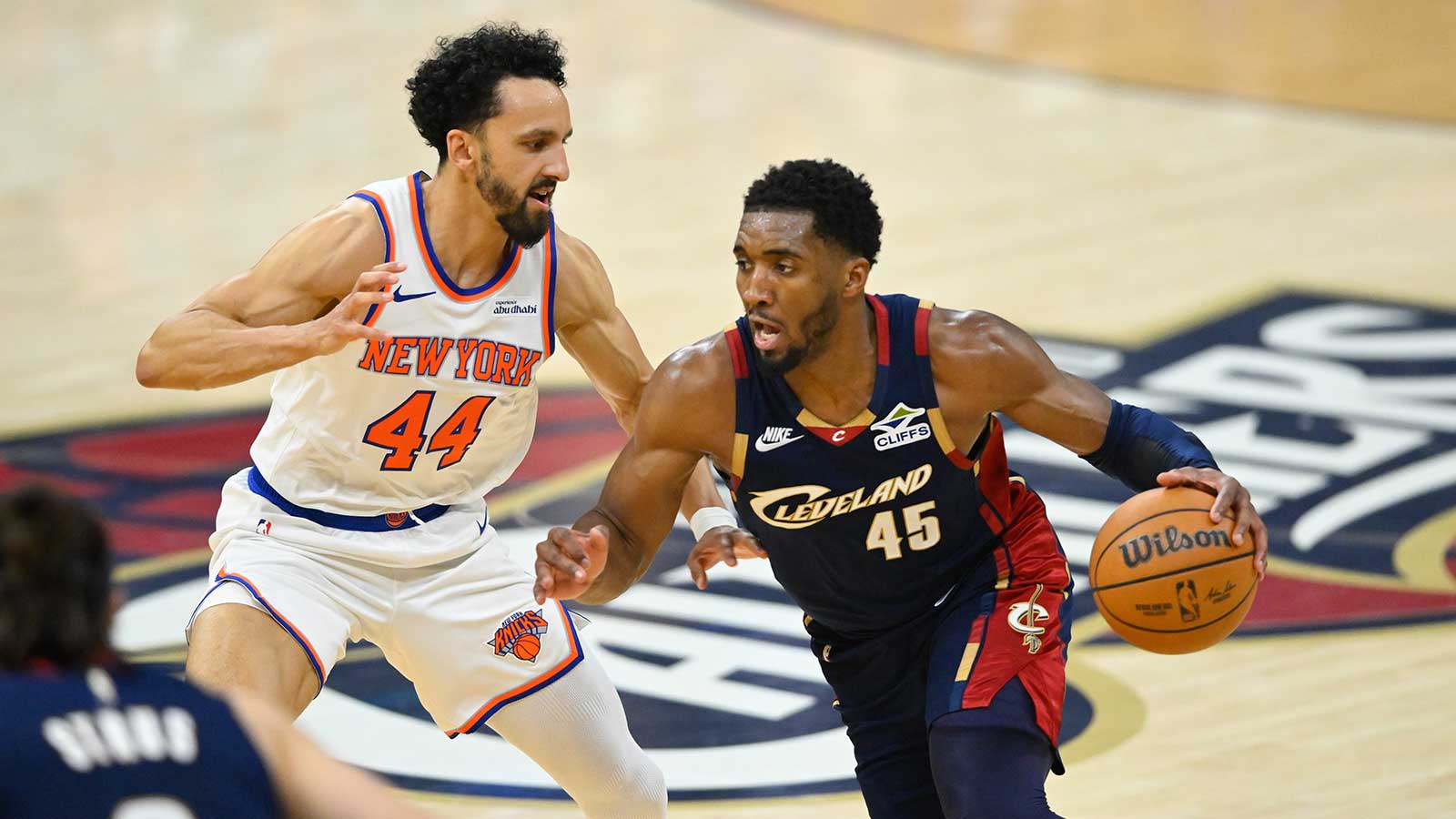 Cleveland Cavaliers guard Donovan Mitchell (45) drives the ball past New York Knicks guard Landry Shamet (44) in the second quarter during game four of the eastern conference finals for the 2026 NBA playoffs at Rocket Arena.