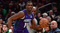 Charlotte Hornets forward Moussa Diabate (14) controls the ball during the second half against the Boston Celtics at TD Garden.