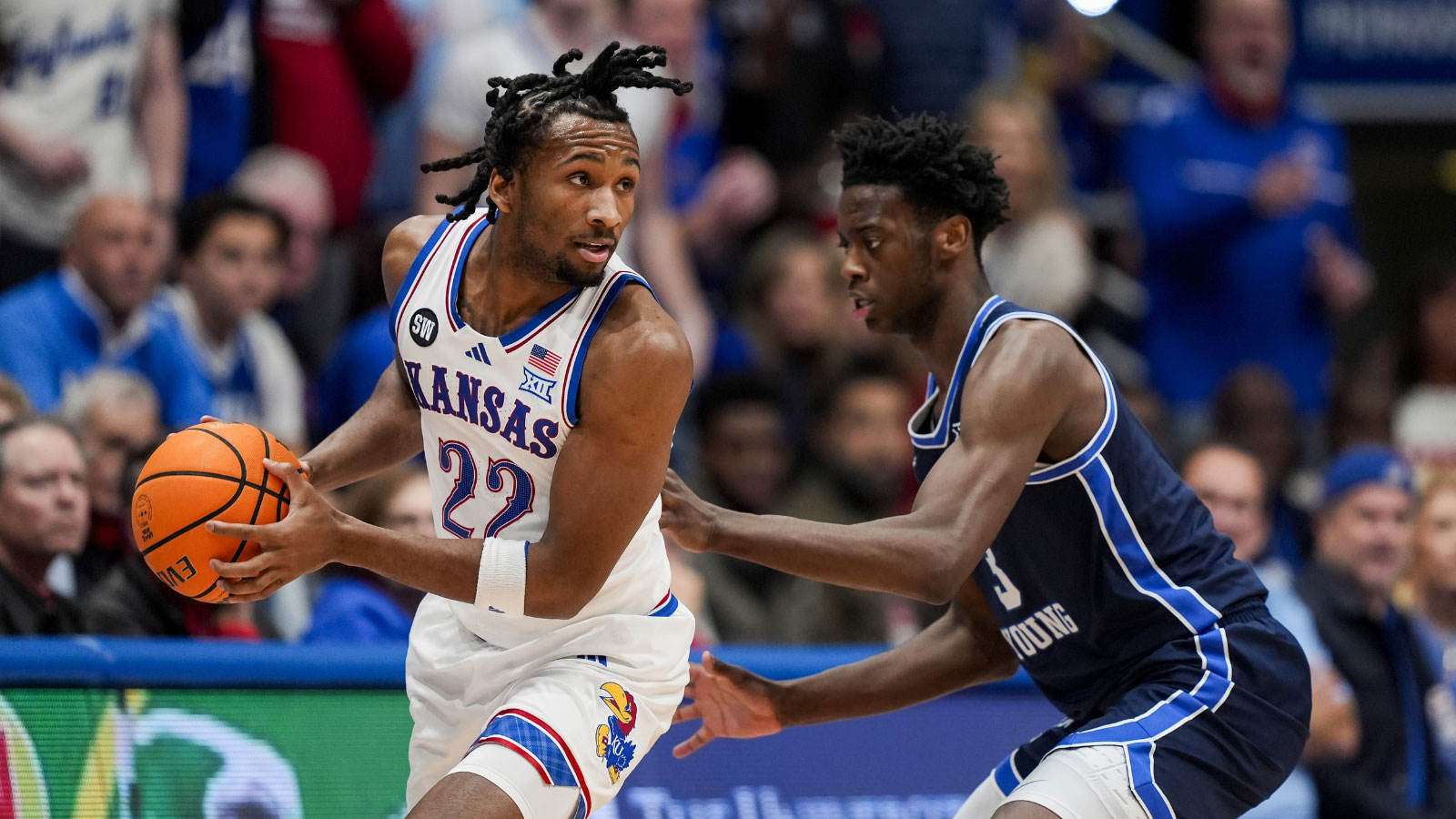 Kansas Jayhawks guard Darryn Peterson (22) looks to pass against BYU Cougars forward AJ Dybantsa (3) during the first half at Mizzou Arena.