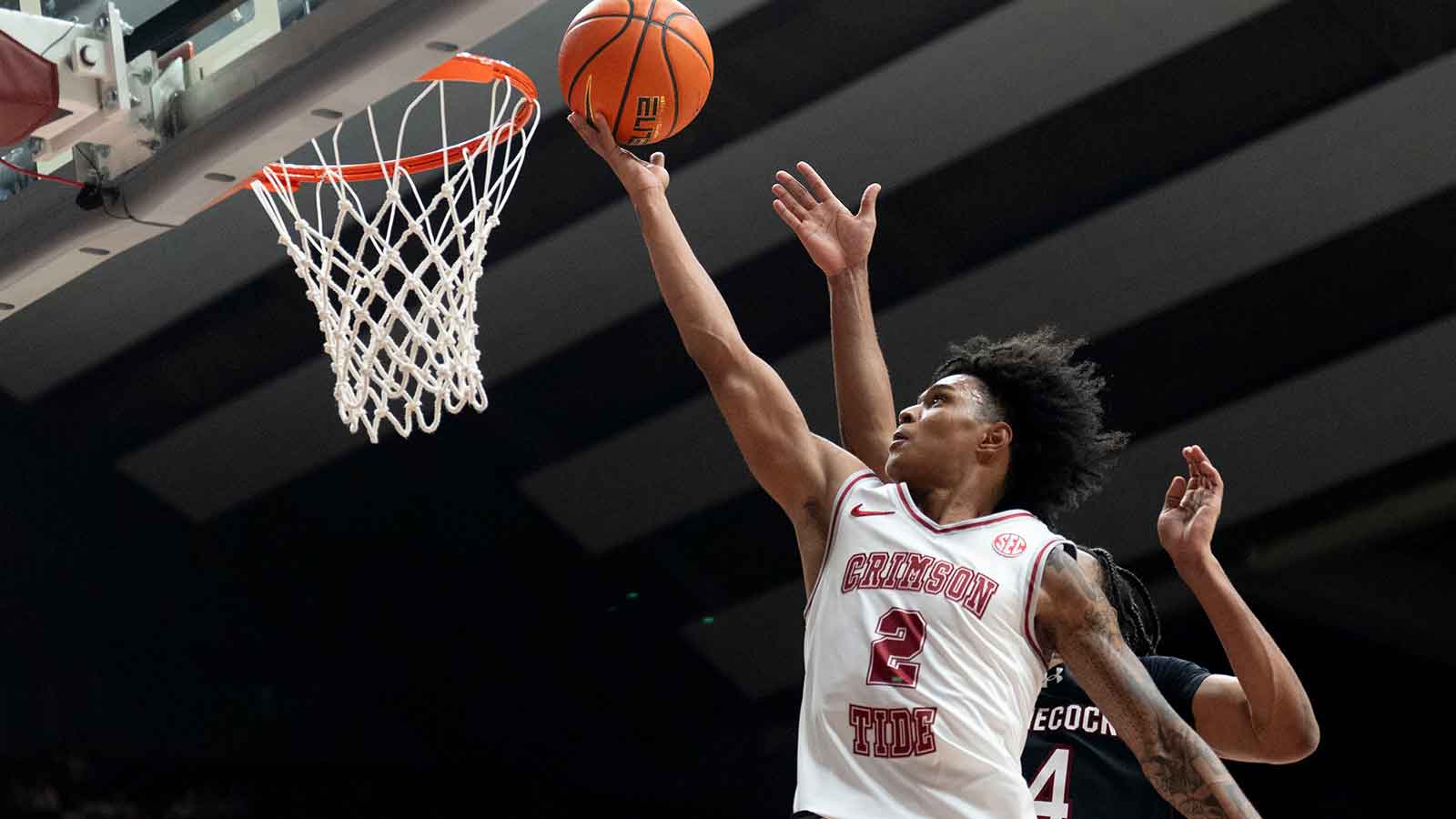 Alabama guard Aden Holloway (2) goes to the basket against South Carolina guard Kobe Knox (4) at Coleman Coliseum. Alabama defeated South Carolina 89-75.