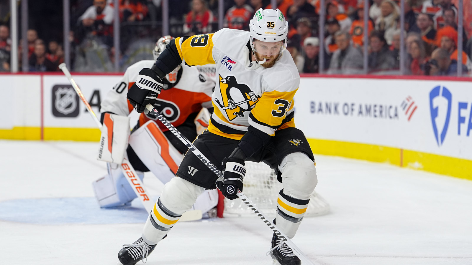 Pittsburgh Penguins right wing Anthony Mantha (39) reaches for the puck against the Philadelphia Flyers in the second period in game six of the first round of the 2026 Stanley Cup Playoffs at Xfinity Mobile Arena.