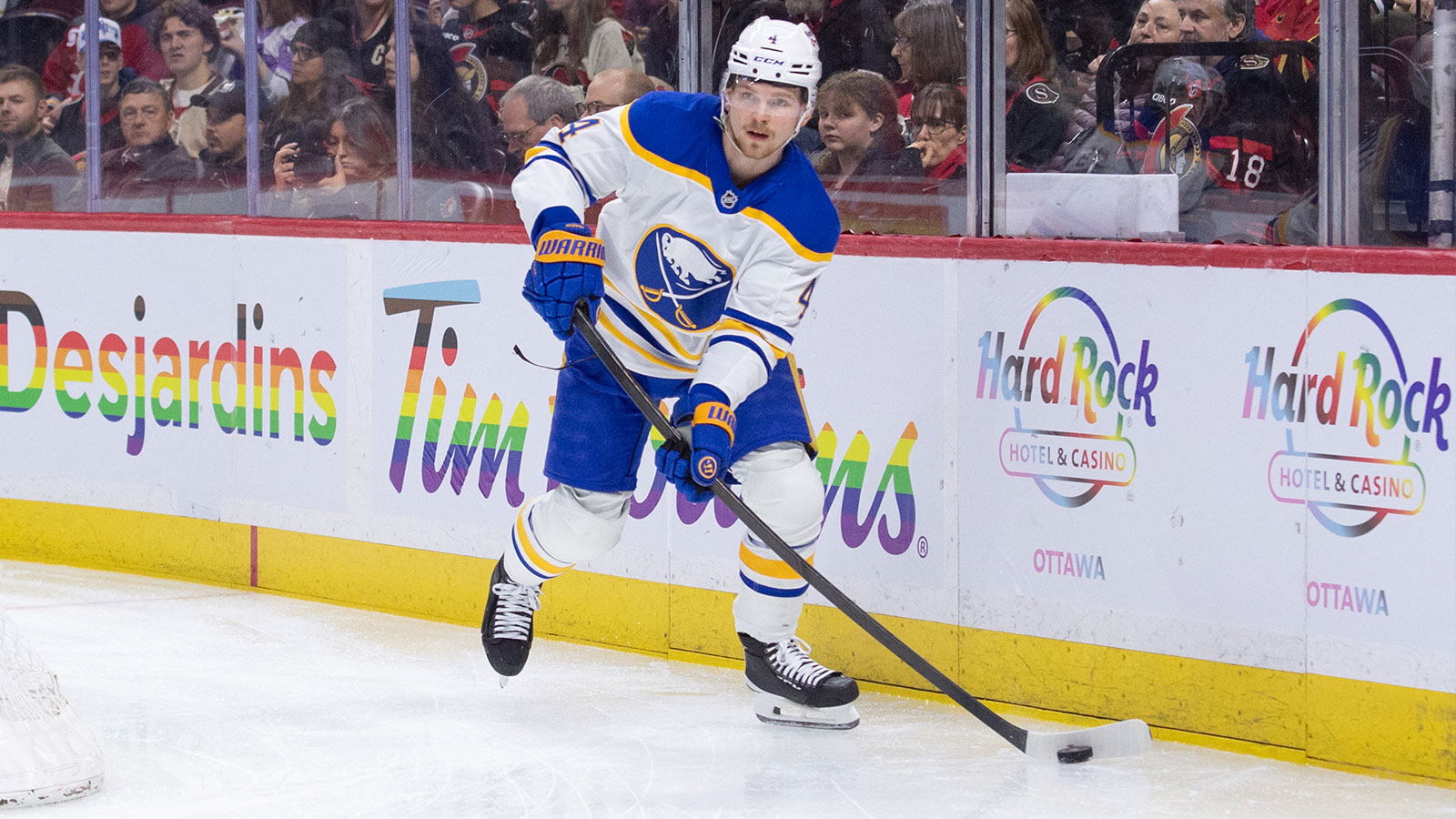 Buffalo Sabres defenseman Bowen Byram (4) skates with the puck in the first period against the Ottawa Senators at the Canadian Tire Centre