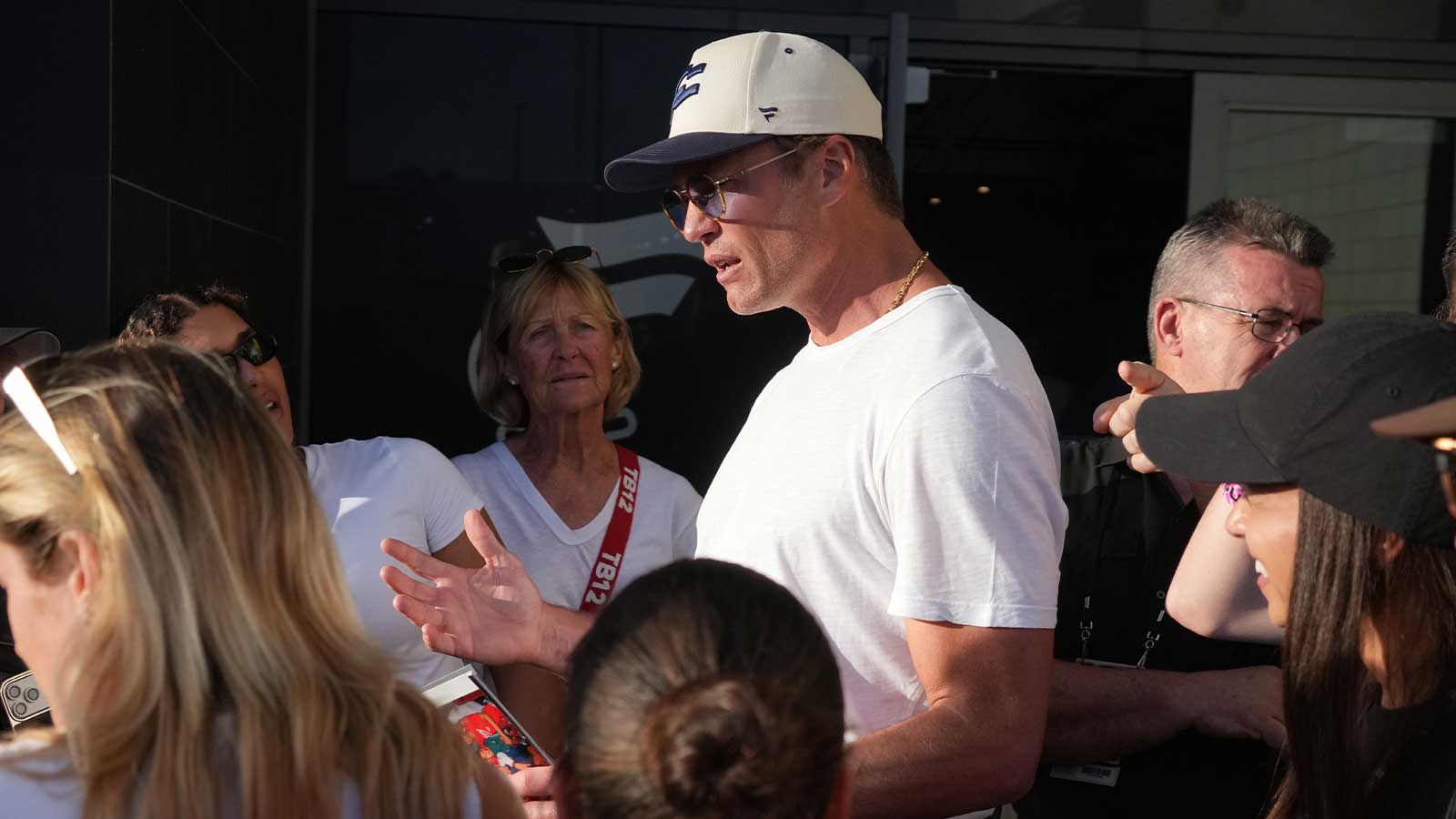 Founders FFC quarterback Tom Brady (12) talks with fans during the Fanatics Flag Football Classic at BMO stadium.