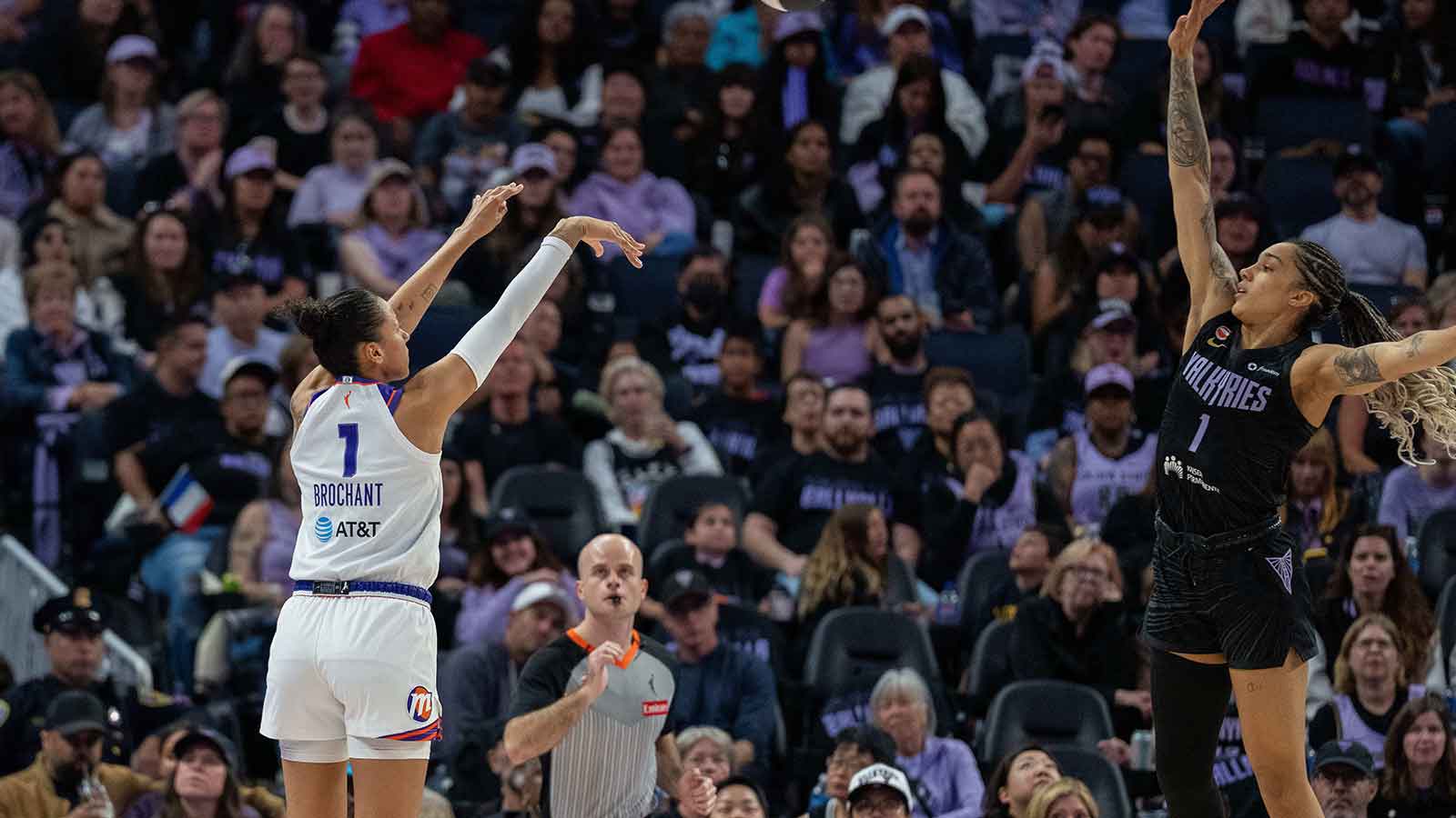 Phoenix Mercury forward Noemie Brochant (1) shoots a three point basket against Golden State Valkyries forward Gabby Williams (1) during the third quarter at Chase Center.