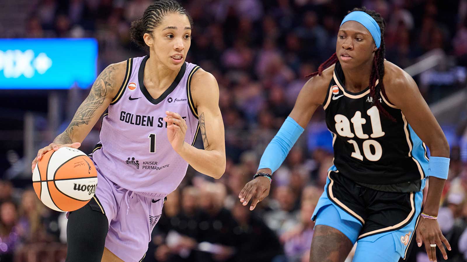 Golden State Valkyries forward Gabby Williams (1) dribbles the ball against Atlanta Dream guard Rhyne Howard (10) during the second quarter at Chase Center.