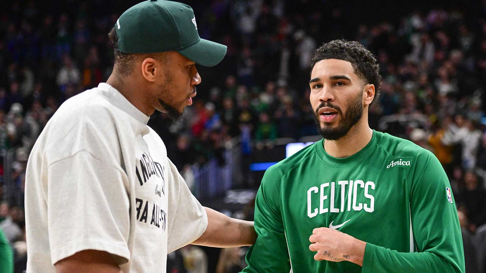 Bucks forward Giannis Antetokounmpo (34) greets Boston Celtics forward Jayson Tatum (0) after the game at Fiserv Forum