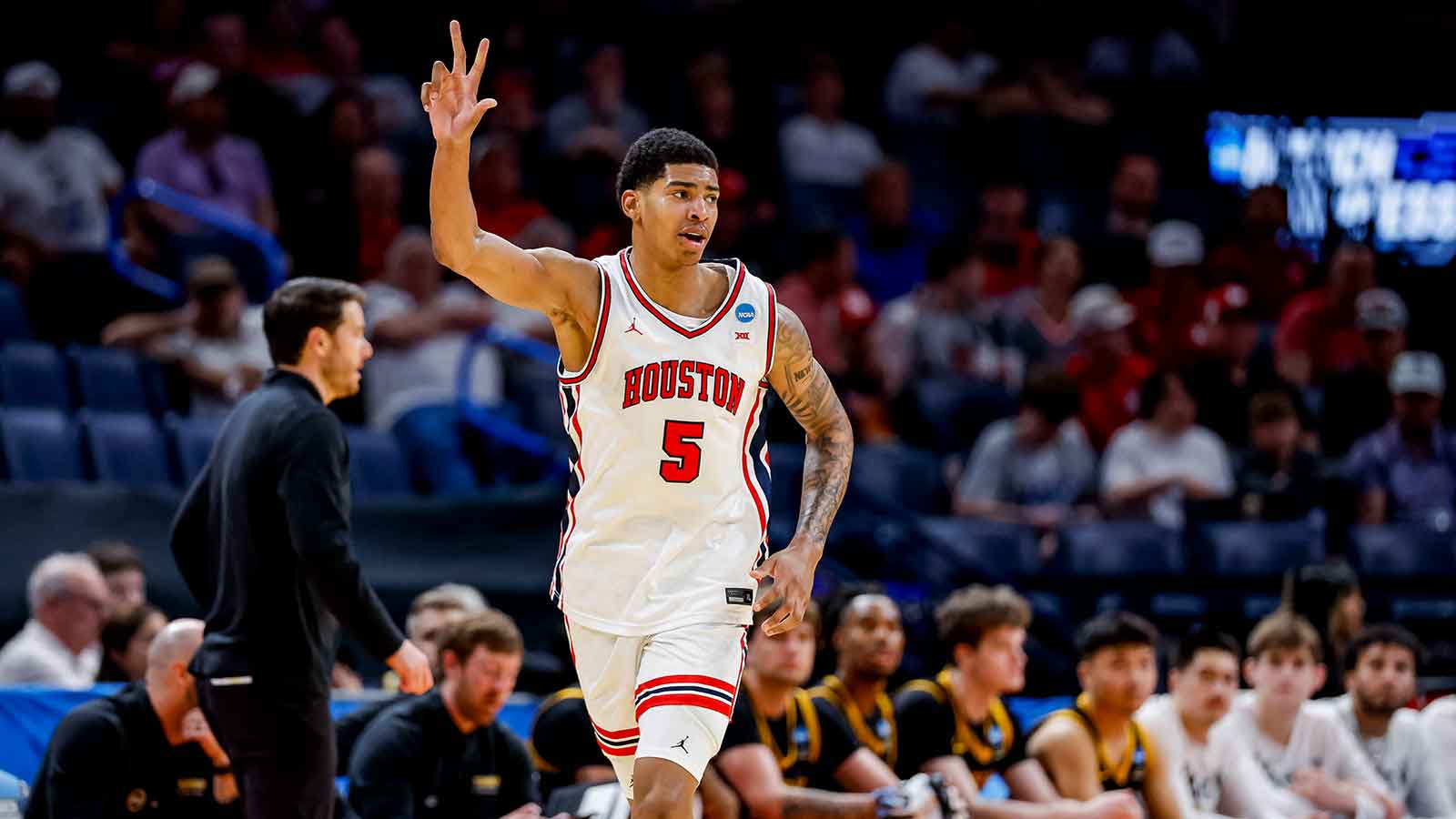 Houston Cougars center Chris Cenac Jr. (5) signals to his team during a first round game of the men's 2026 NCAA Tournament at Paycom Center.