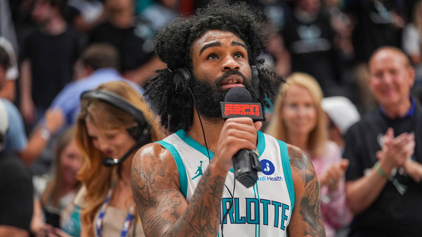 Charlotte Hornets guard Coby White (3) gives an interview after the overtime win during the play-in rounds between the Charlotte Hornets and the Miami Heat of the 2026 NBA Playoffs at Spectrum Center. 