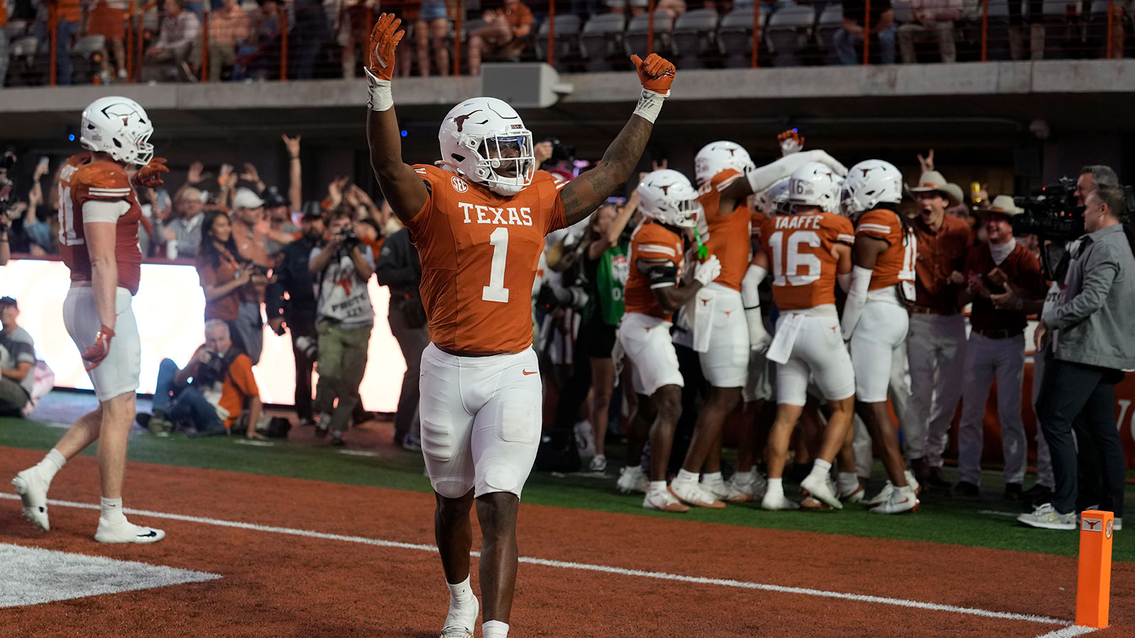 Texas Longhorns defensive lineman Colin Simmons (1) reacts after a fumble was recovered for a touchdown during the second half against the Arkansas Razorbacks at Darrell K Royal-Texas Memorial Stadium.