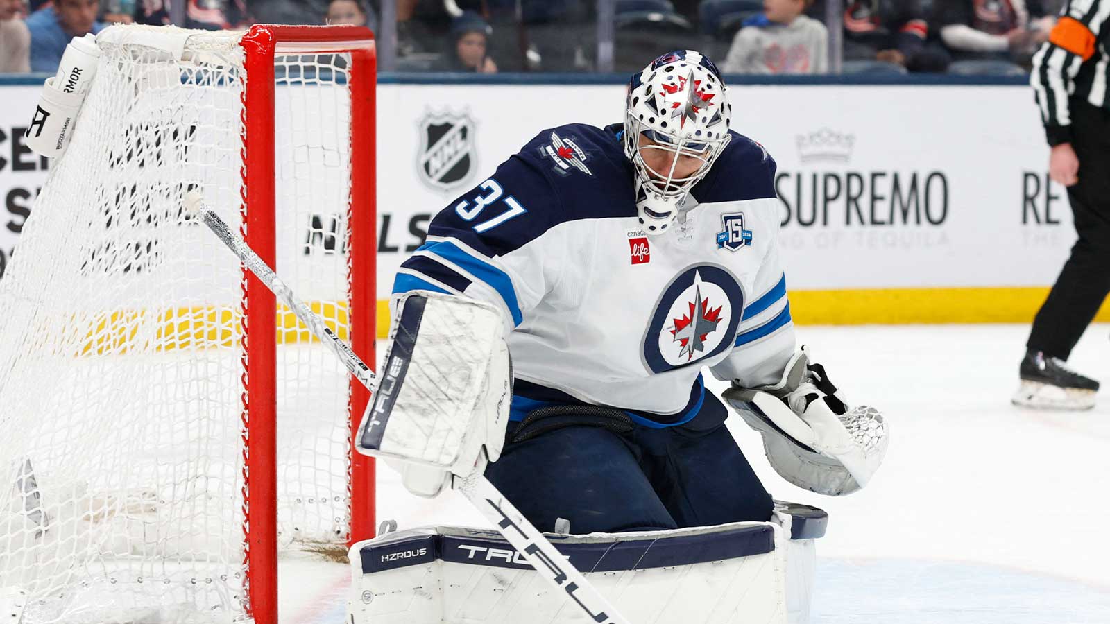 Winnipeg Jets goalie Connor Hellebuyck (37) makes a save against the Columbus Blue Jackets during the second period at Nationwide Arena.
