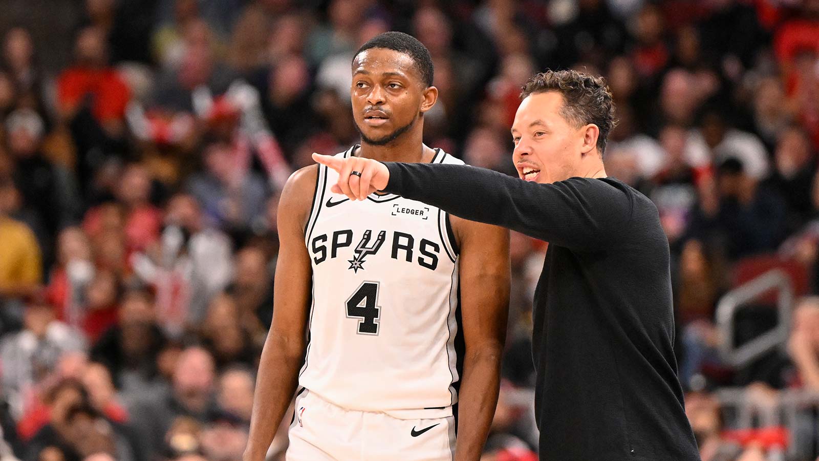 Spurs' Mitch Johnson gives flowers to De'Aaron Fox for playing through ankle injury