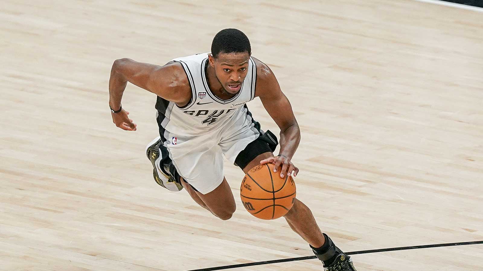 San Antonio Spurs guard De'aaron Fox (4) drives to the basket against the New York Knicks during game five of the 2026 NBA Finals at Frost Bank Center.