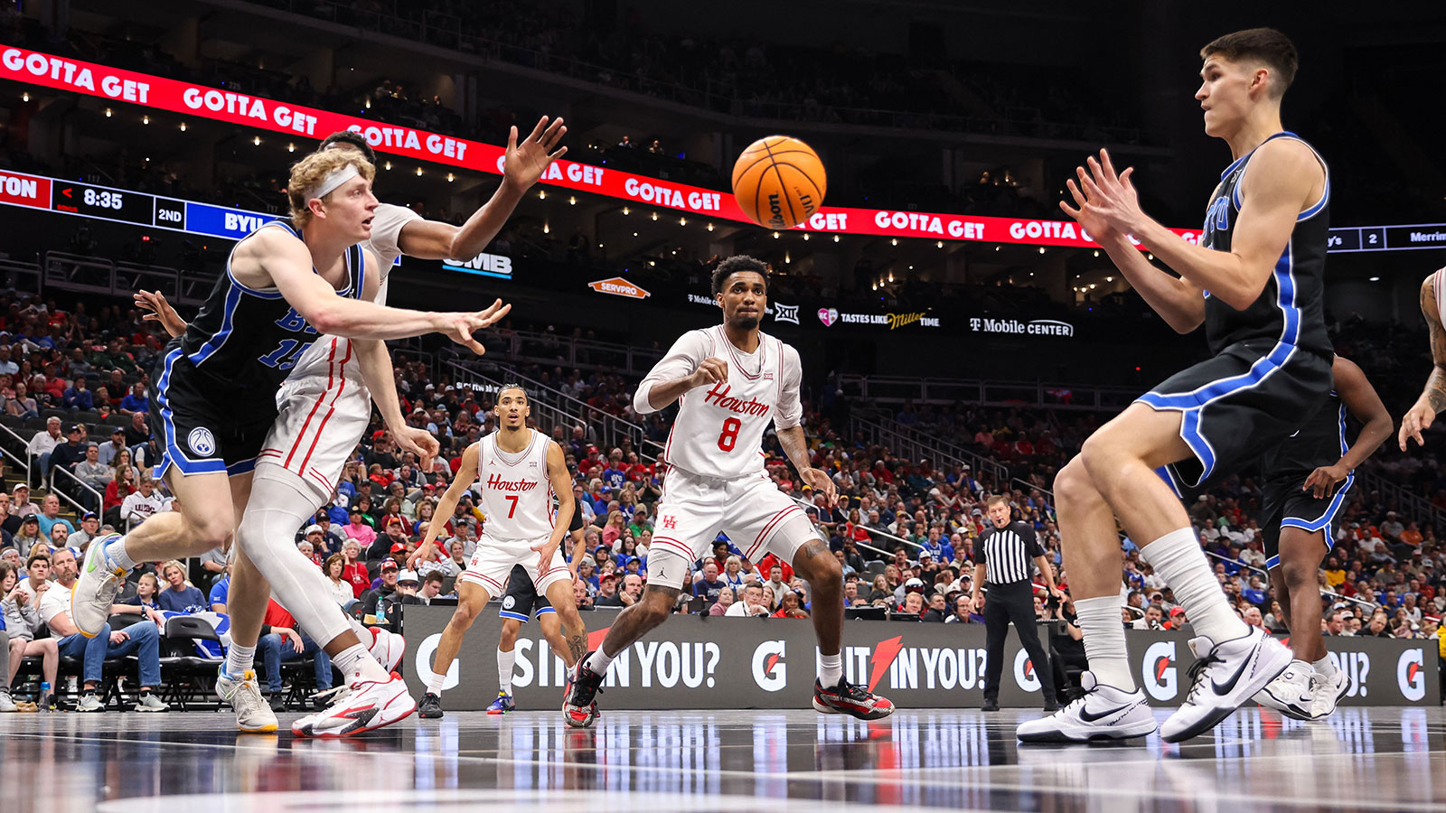 Brigham Young Cougars forward Richie Saunders (15) passes the ball to Brigham Young Cougars guard Egor Demin (3) during the second half at T-Mobile Center.