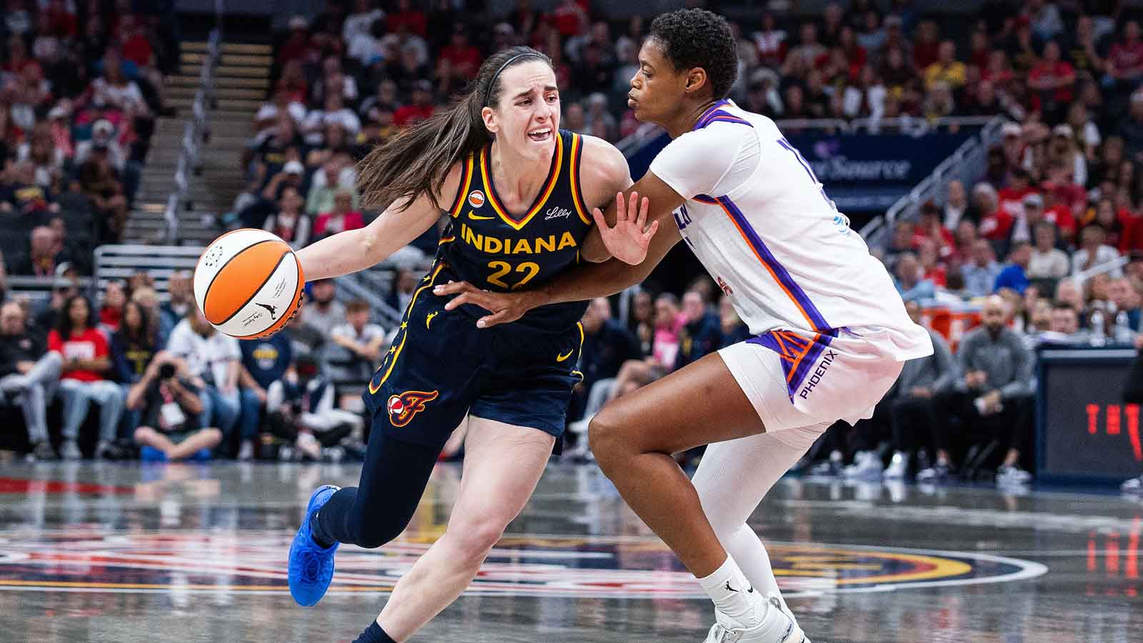Indiana Fever guard Caitlin Clark dribbles against the Phoenix Mercury at Gainbridge Fieldhouse