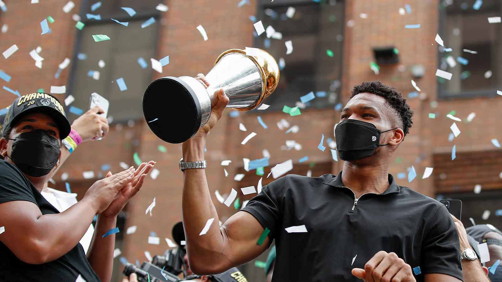Milwaukee Bucks forward Giannis Antetokounmpo (34) holds his NBA Finals MVP Trophy during the Milwaukee Bucks victory parade. 