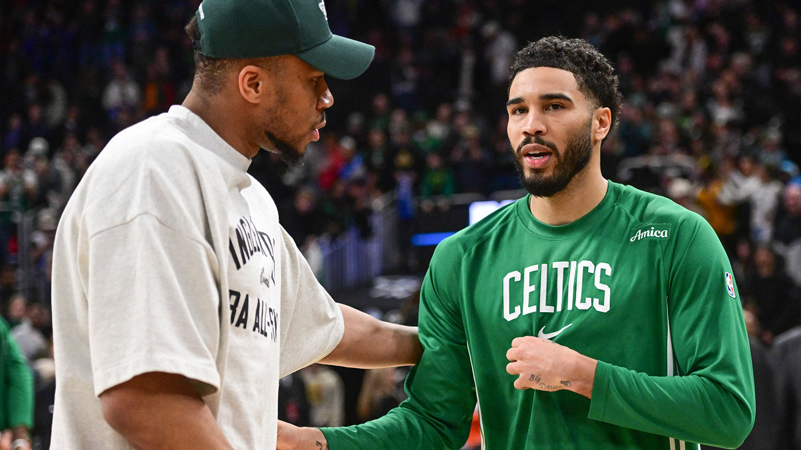 Milwaukee Bucks forward Giannis Antetokounmpo (34) greets Boston Celtics forward Jayson Tatum (0) after the game at Fiserv Forum.
