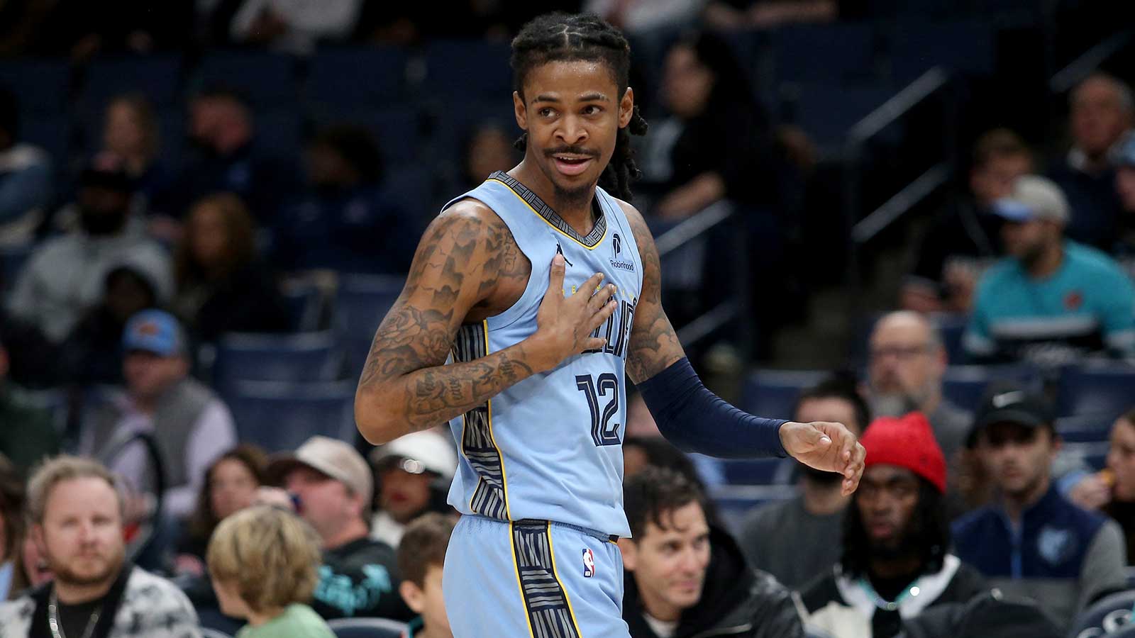 Grizzlies guard Ja Morant (12) reacts during the first quarter against the Atlanta Hawks at FedExForum