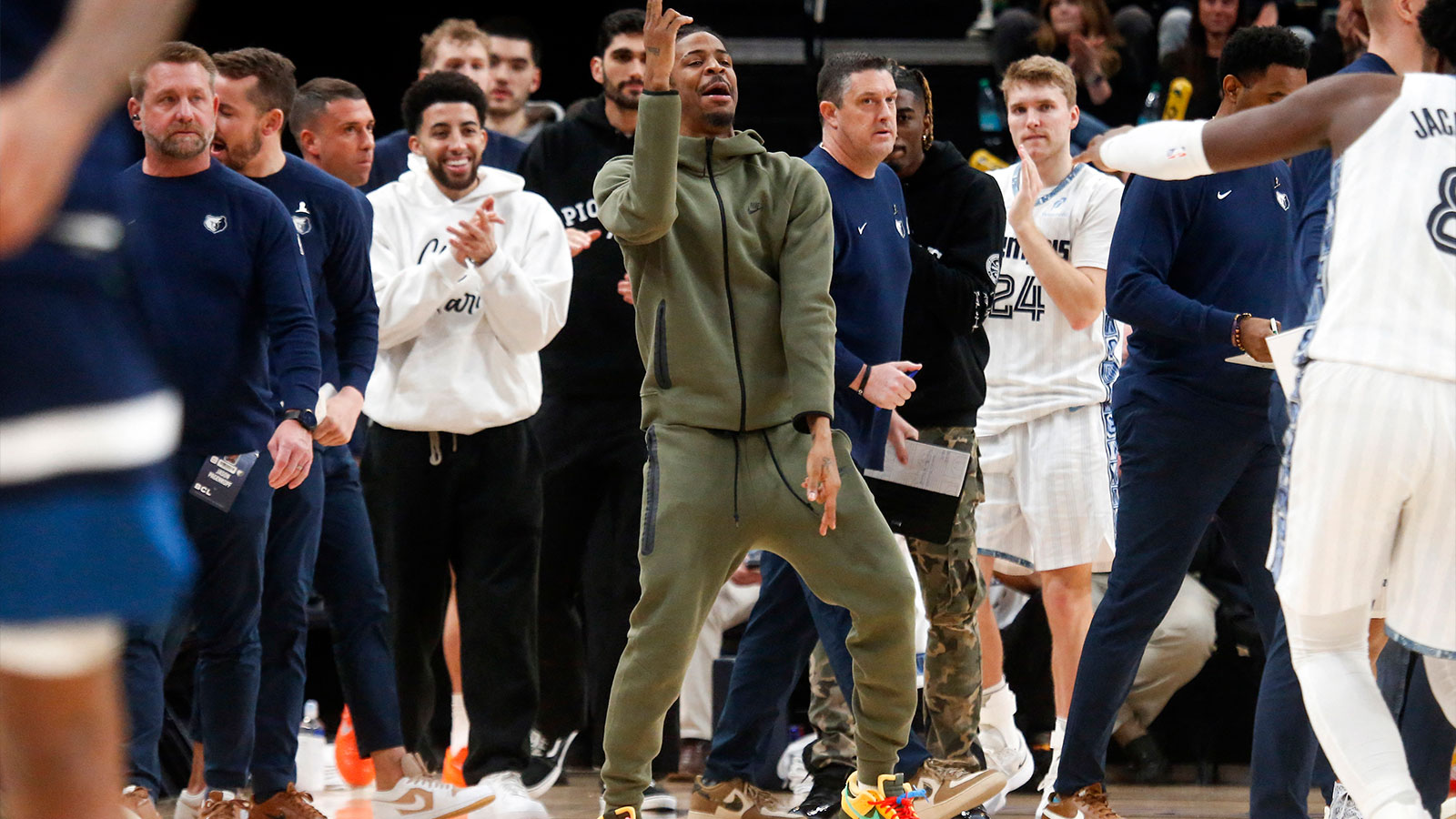 Grizzlies guard Ja Morant (12) reacts with forward/center Jaren Jackson Jr. (8) after a basket during the fourth quarter against the Minnesota Timberwolves at FedExForum