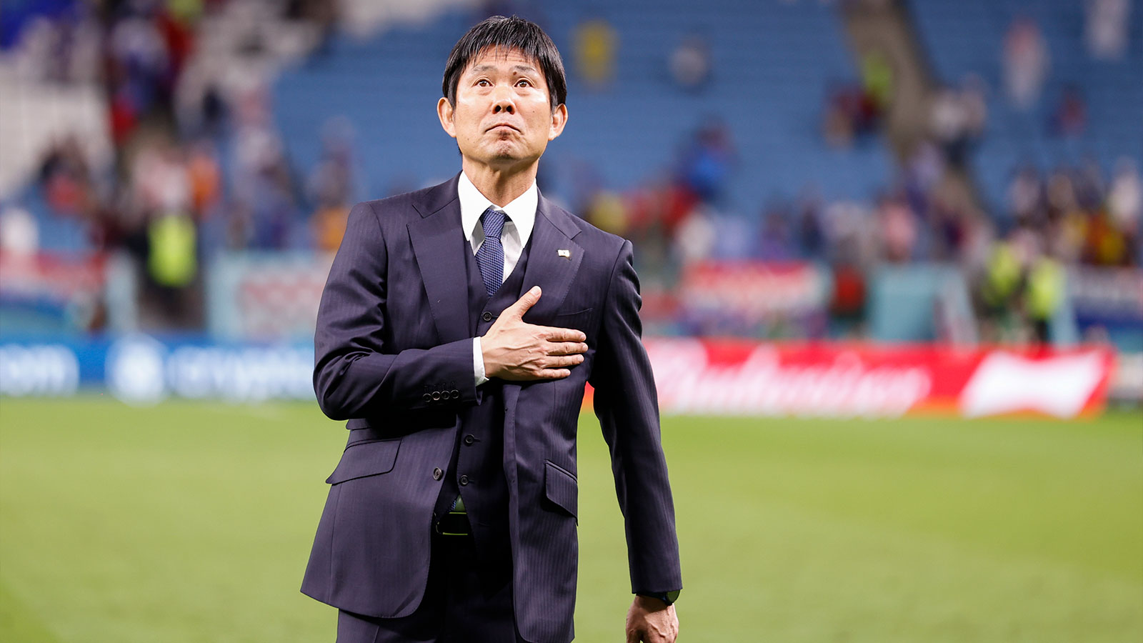 Japan manager Hajime Moriyasu acknowledges fans following their 3-1 loss on penalty kicks to Croatia during a round of sixteen match during the 2022 FIFA World Cup at Al-Janoub Stadium. 