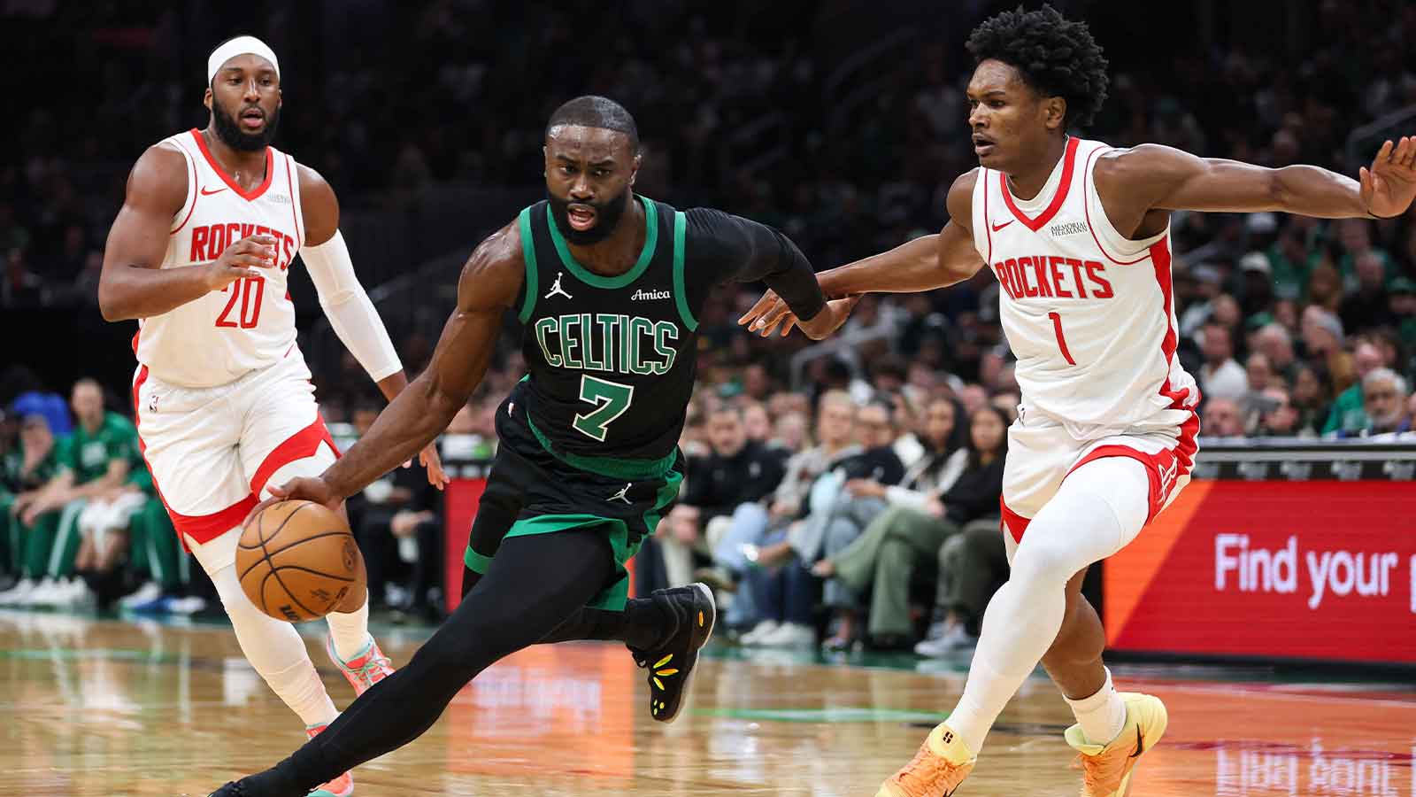 Boston Celtics forward Jaylen Brown (7) drives to the basket during the first half against the Houston Rockets at TD Garden. 