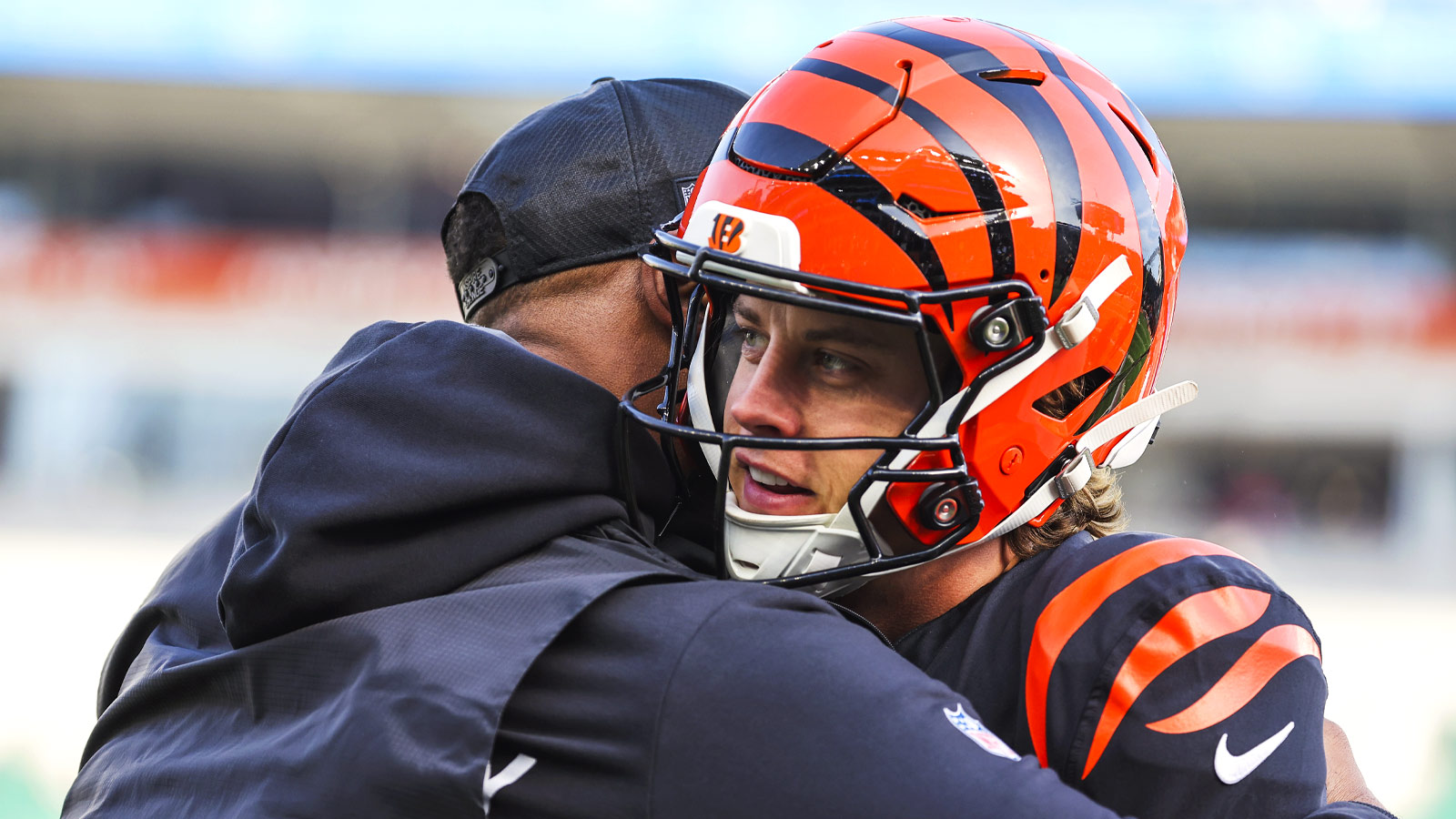 Cincinnati Bengals quarterback Joe Burrow (9) takes a break from pregame warmups against the Cleveland Browns at Paycor Stadium