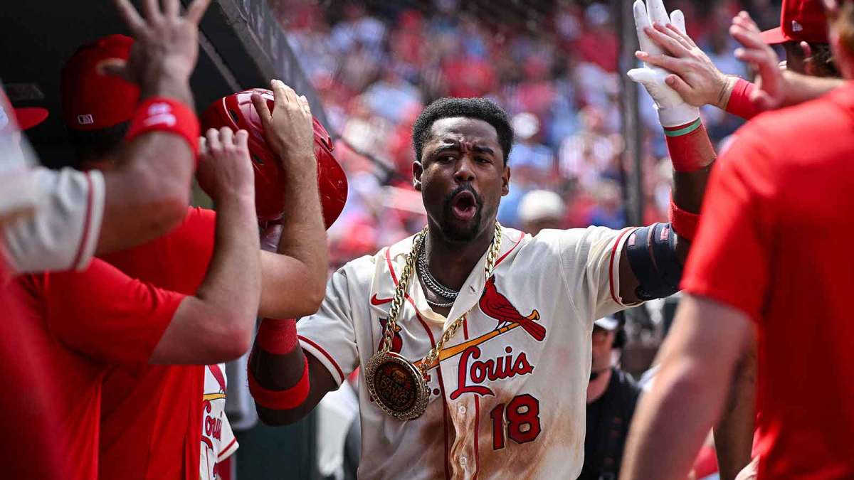 St. Louis Cardinals right fielder Jordan Walker (18) celebrates with teammates after hitting a solo home run against the Cincinnati Reds during the fifth inning at Busch Stadium.