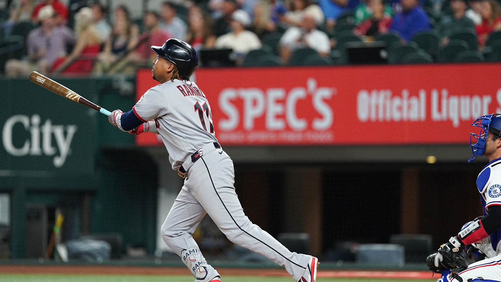 Cleveland Guardians third baseman Jose Ramirez (11) hits a home run during the third inning against the Texas Rangers at Globe Life Field.