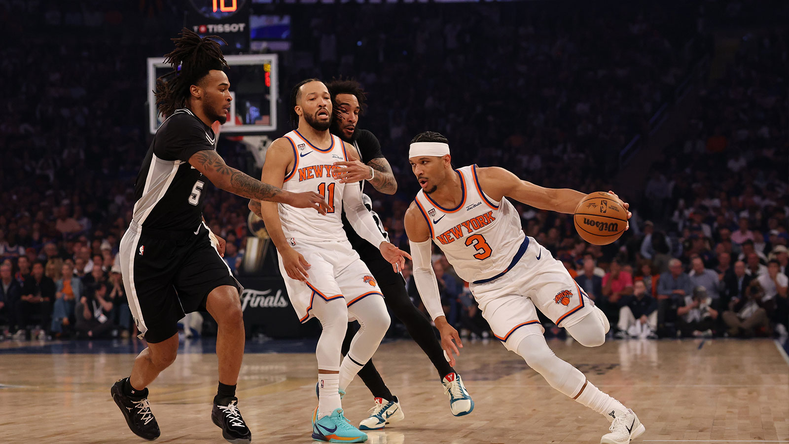 New York Knicks guard Josh Hart (3) dribbles the ball around a screen by Knicks guard Jalen Brunson (11) as San Antonio Spurs guard Stephon Castle (5) and Spurs forward Julian Champagnie (30) defend during game three of the 2026 NBA Finals at Madison Square Garden