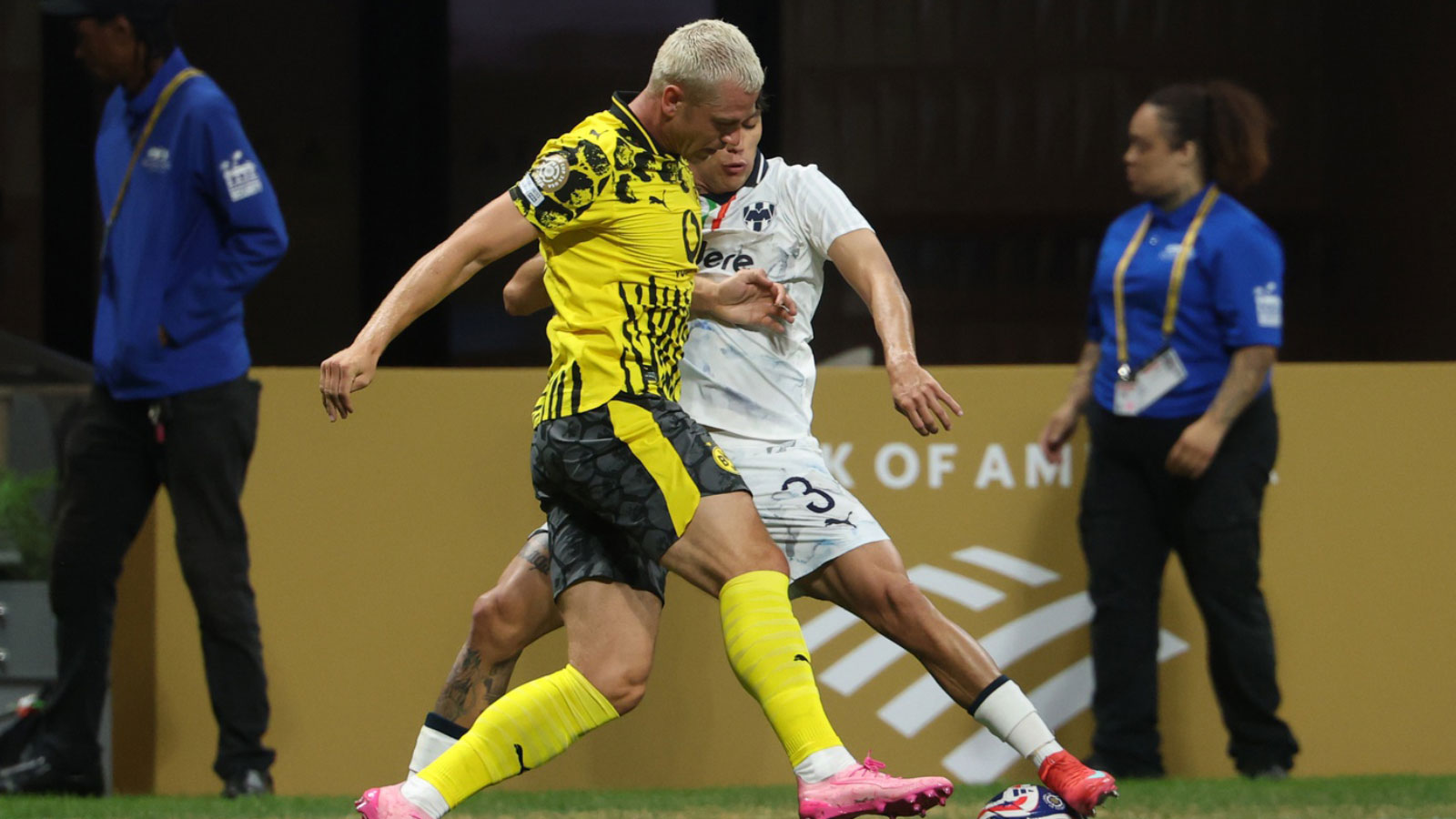 Borussia Dortmund defender Julian Ryerson (26) and CF Monterrey defender Gerardo Arteaga (3) fight for the ball during a round of 16 match of the 2025 FIFA Club World Cup at Mercedes-Benz Stadium. 