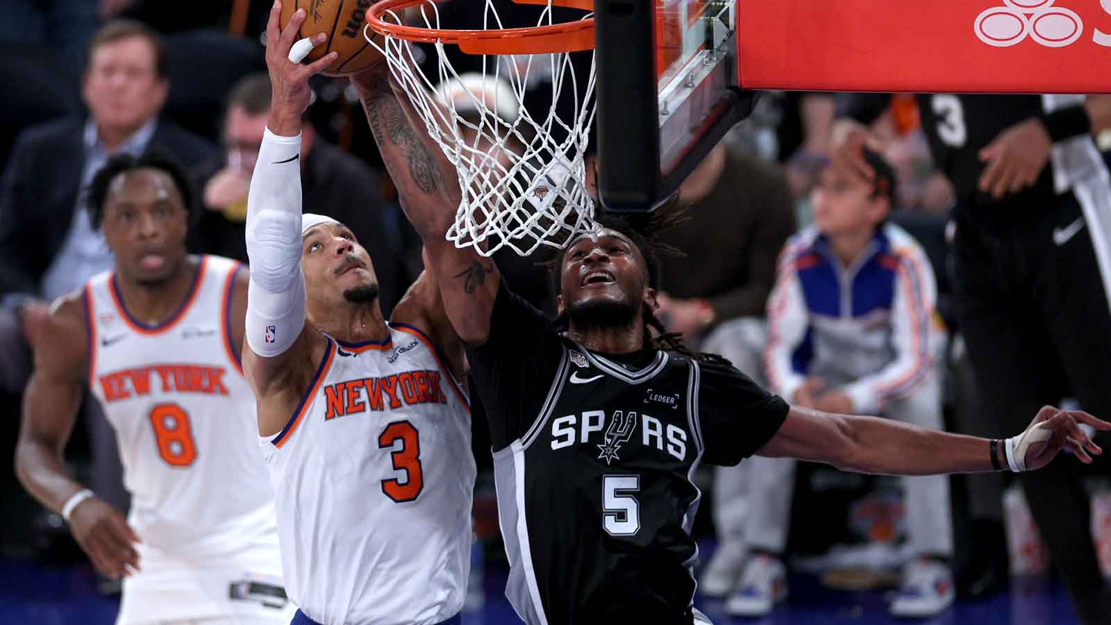 New York Knicks guard Josh Hart (3) shoots against San Antonio Spurs guard Stephon Castle (5) in the third quarter during game three of the 2026 NBA Finals at Madison Square Garden. Mandatory Credit: Vincent Carchietta-Imagn Images