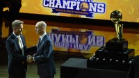 NBA commissioner Adam Silver (right) congratulates Golden State Warriors head coach Steve Kerr (left) before the game against the New Orleans Pelicans at Oracle Arena