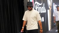 Knicks guard Jalen Brunson arrives at the arena before the game between the San Antonio Spurs and the New York Knicks in game two of the 2026 NBA Finals at Frost Bank Center with Charles Barkley in the background