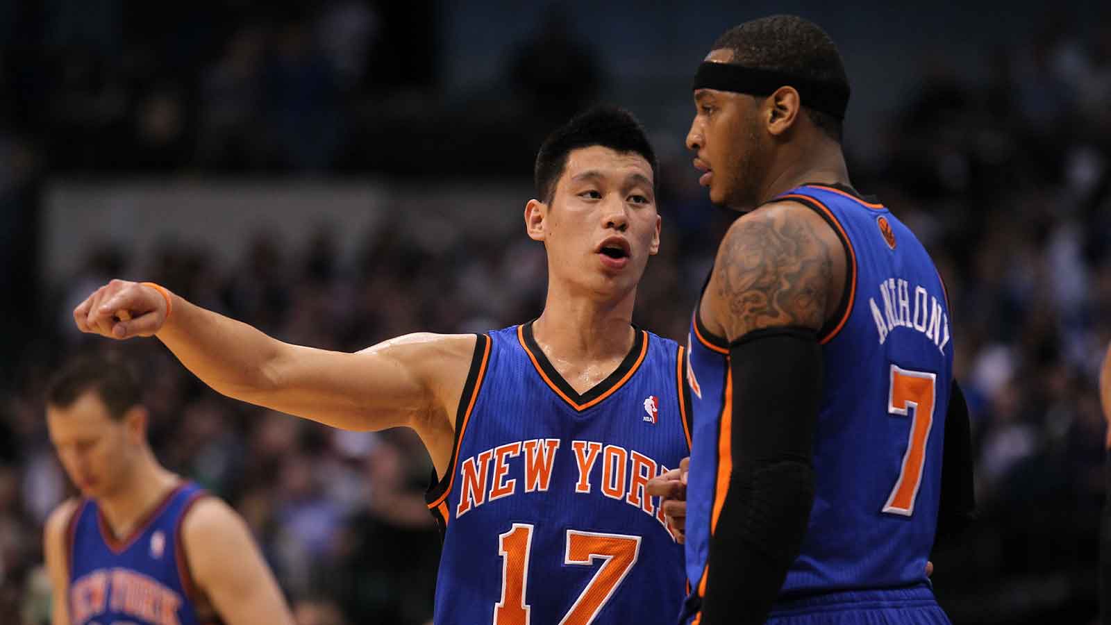 Knicks guard Jeremy Lin (17) talks with forward Carmelo Anthony (7) in the first quarter against the Dallas Mavericks at American Airlines Center