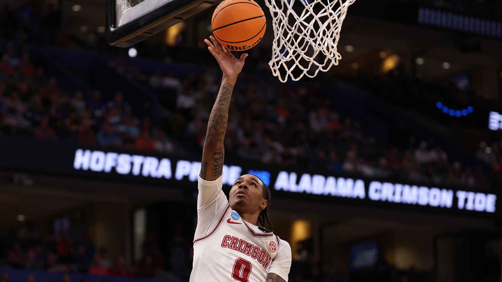 Alabama Crimson Tide guard Labaron Philon (0) shoots in the second half against the Hofstra Pride during a first round game of the men's 2026 NCAA Tournament at Benchmark International Arena.