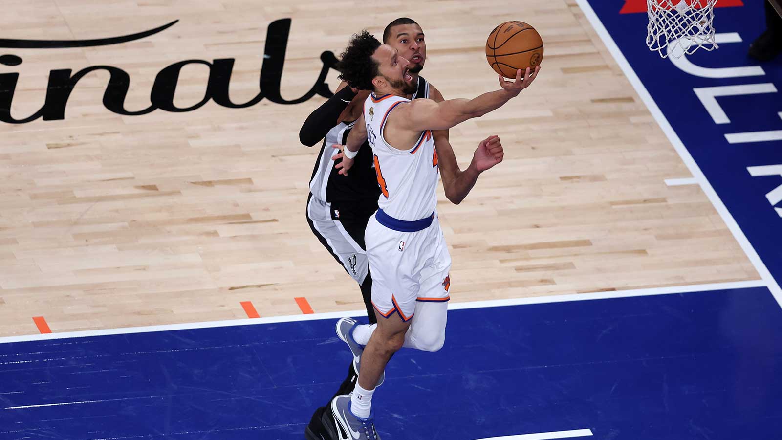 New York Knicks guard Landry Shamet (44) shoots the ball against San Antonio Spurs forward Victor Wembanyama (1) during game three of the 2026 NBA Finals in the third quarter at Madison Square Garden.