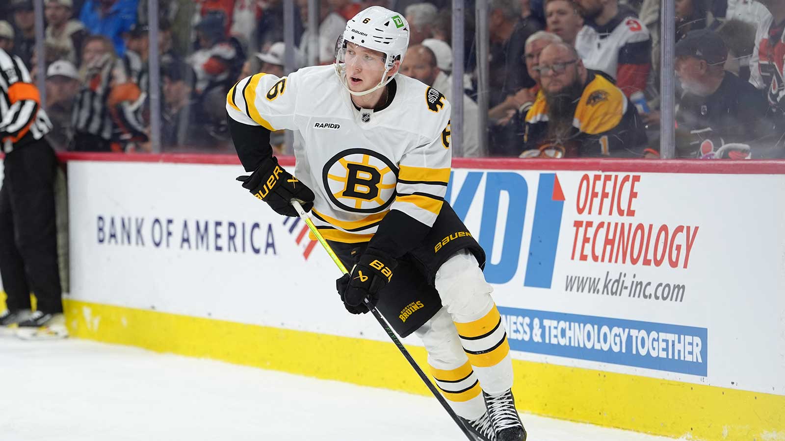 Boston Bruins defenseman Mason Lohrei (6) controls the puck against the Philadelphia Flyers in the first period at Xfinity Mobile Arena. 