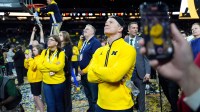 Michigan head coach Dusty May watches the Jumbotron during the NCAA national championship trophy after the team beat Connecticut at Lucas Oil Stadium in Indianapolis on Monday, April 6, 2026.