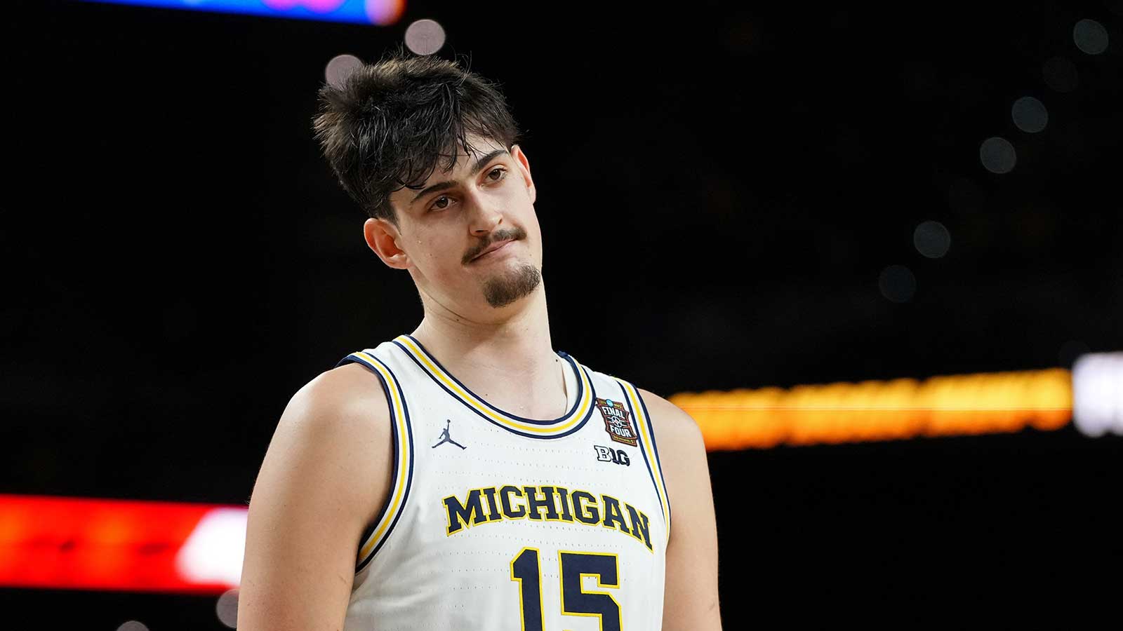 Michigan Wolverines center Aday Mara (15) reacts after a play against the UConn Huskies during the first half in the national championship of the Final Four of the men's 2026 NCAA Tournament between the and the Michigan Wolverines at Lucas Oil Stadium