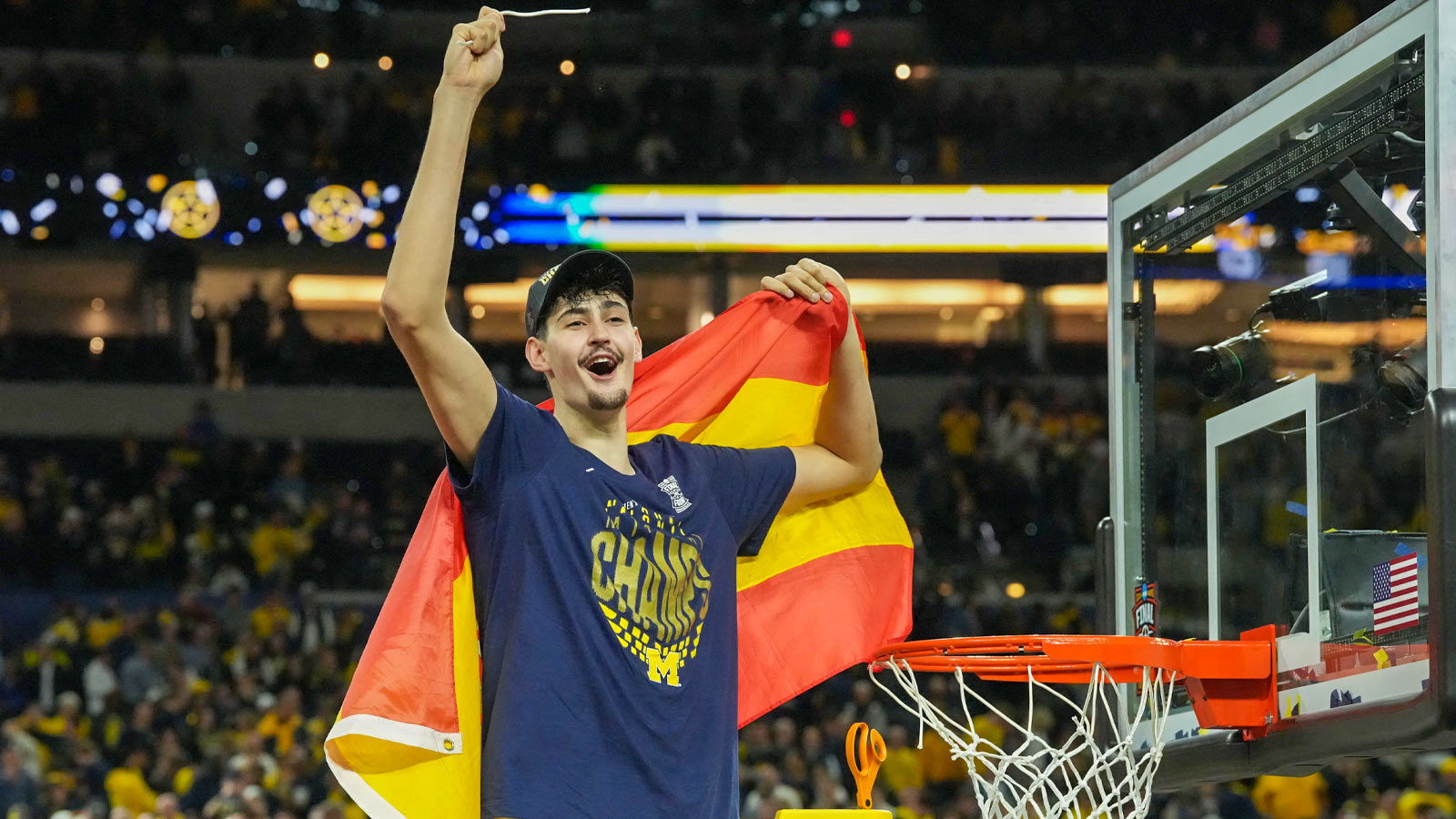 Michigan Wolverines center Aday Mara (15) celebrates after cutting down a piece of the net after defeating the Connecticut Huskies in the national championship of the Final Four of the men's 2026 NCAA Tournament at Lucas Oil Stadium