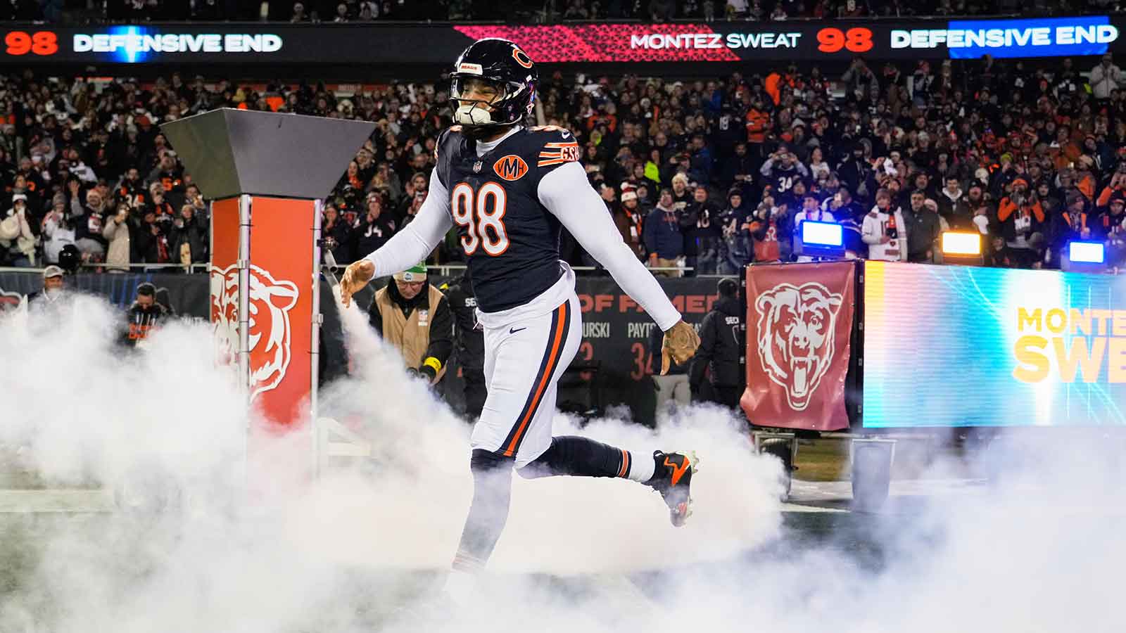 Chicago Bears defensive end Montez Sweat (98) runs onto the field during player introductions before the game against the Green Bay Packers at Soldier Field.